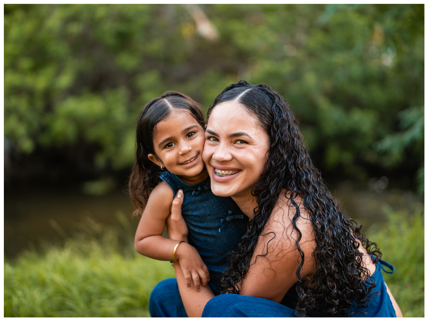Mother and daughter hugging near the water at Buschman Park in Port Orange