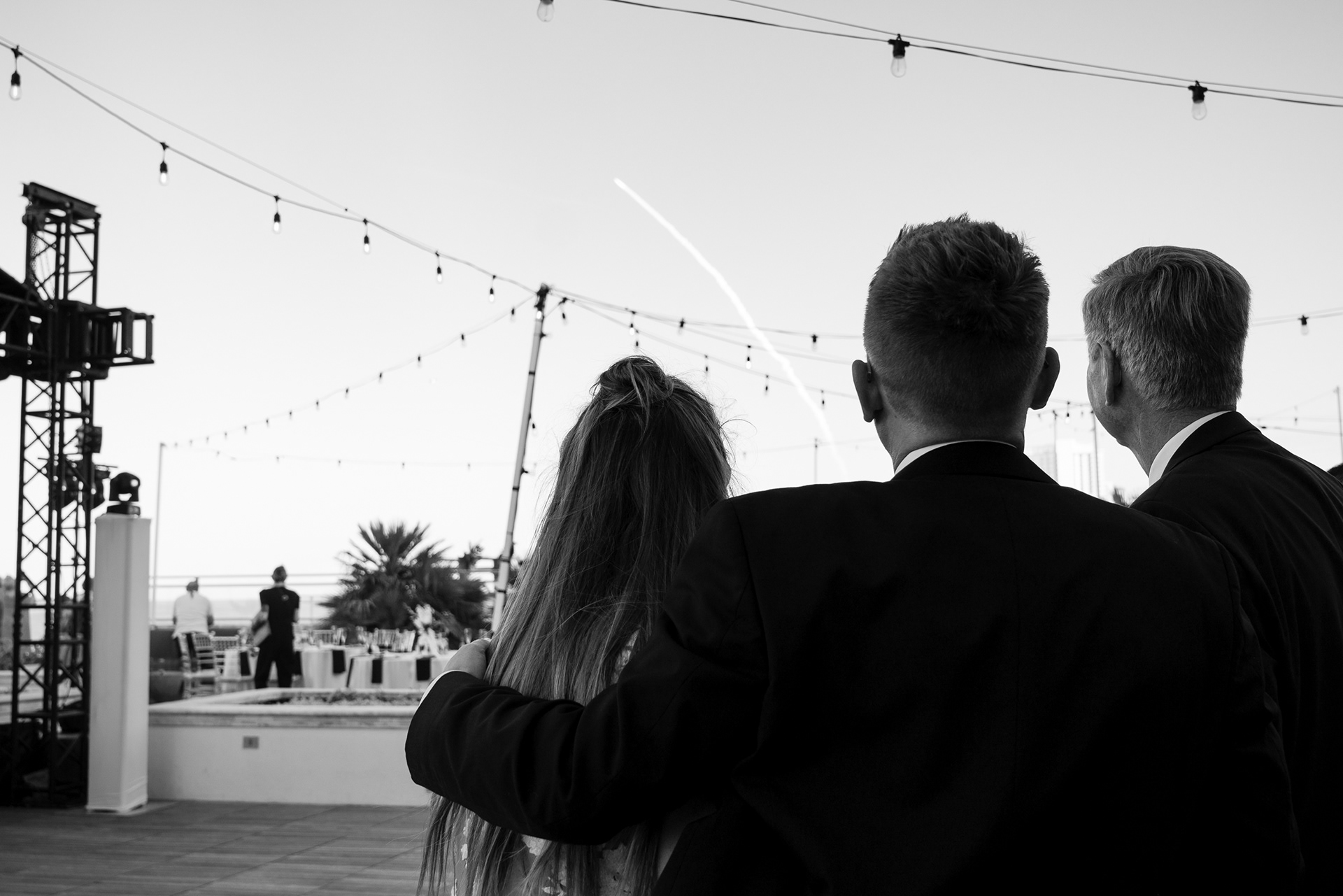 Black and white candid family moment during a wedding reception at Hard Rock Hotel Daytona Beach.