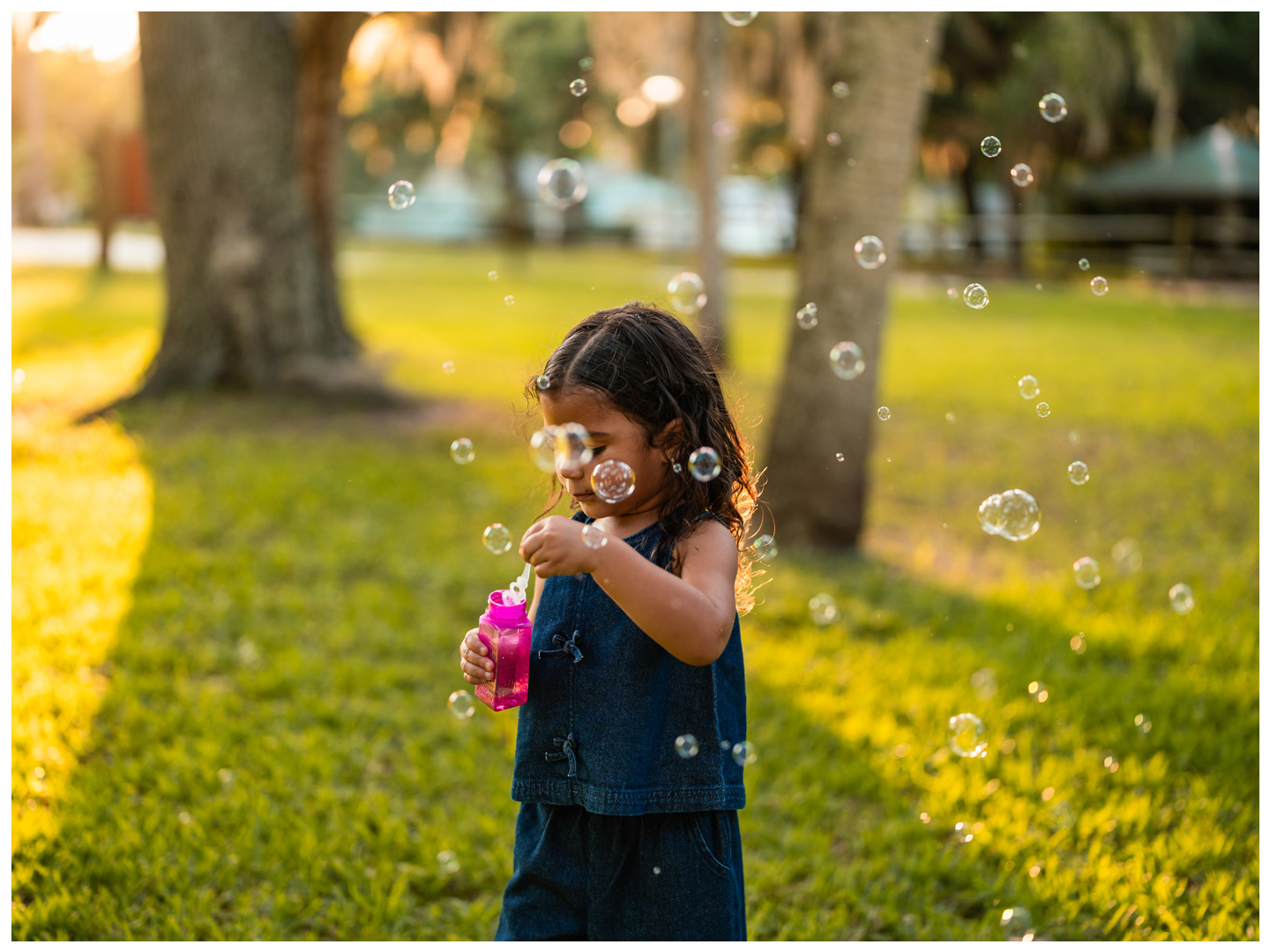 Candid child portrait with bubbles at Buschman Park in Port Orange Florida