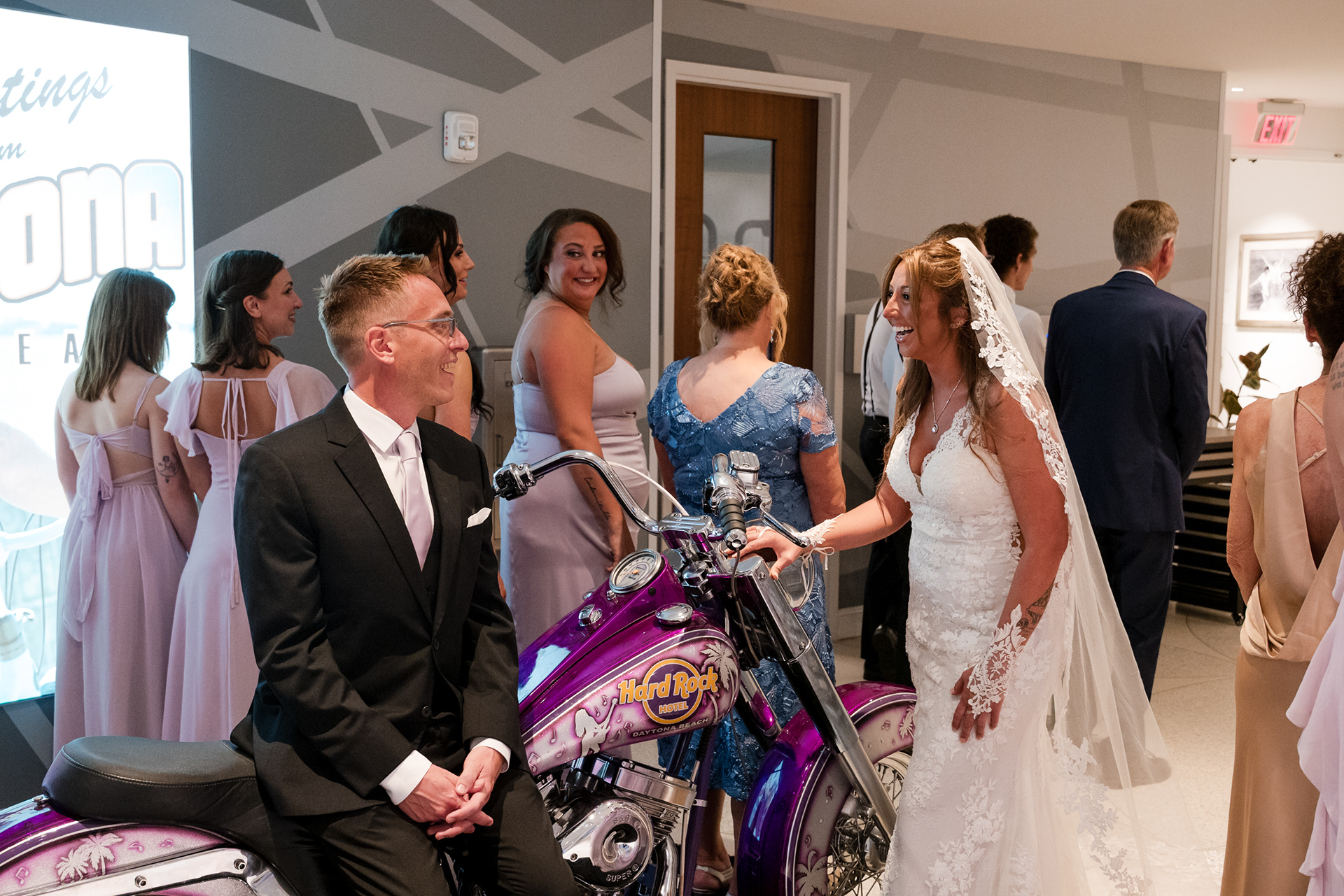 Bride walking into the first look at Hard Rock Hotel Daytona Beach with guests watching.