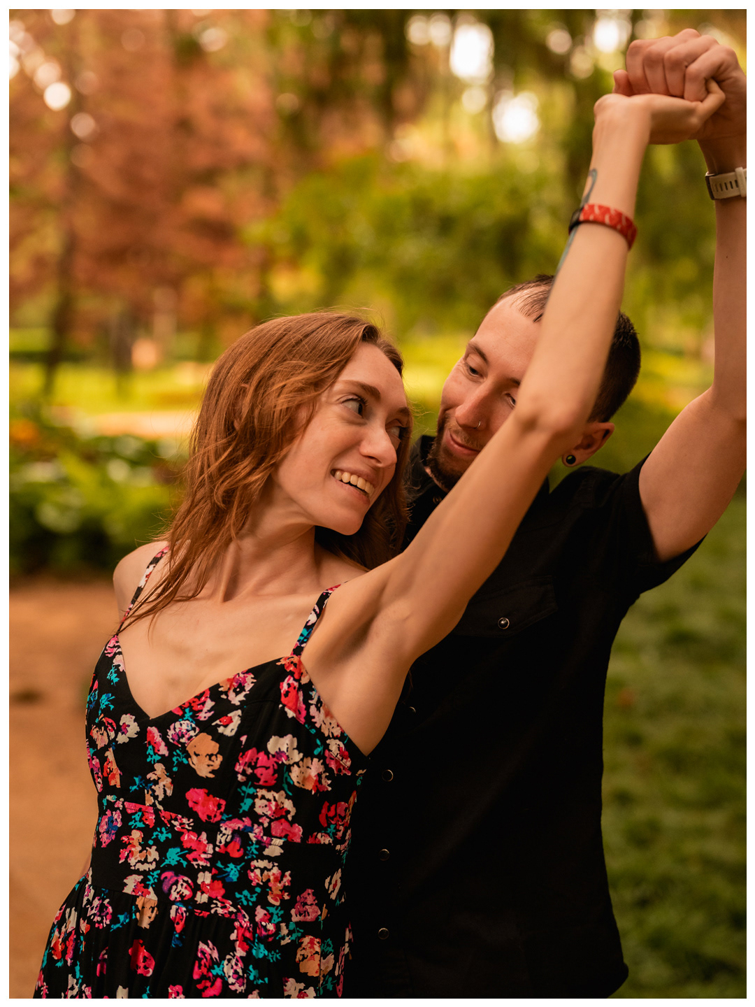 Man twirling his partner with their hands joined at Washington Oaks Gardens State Park.