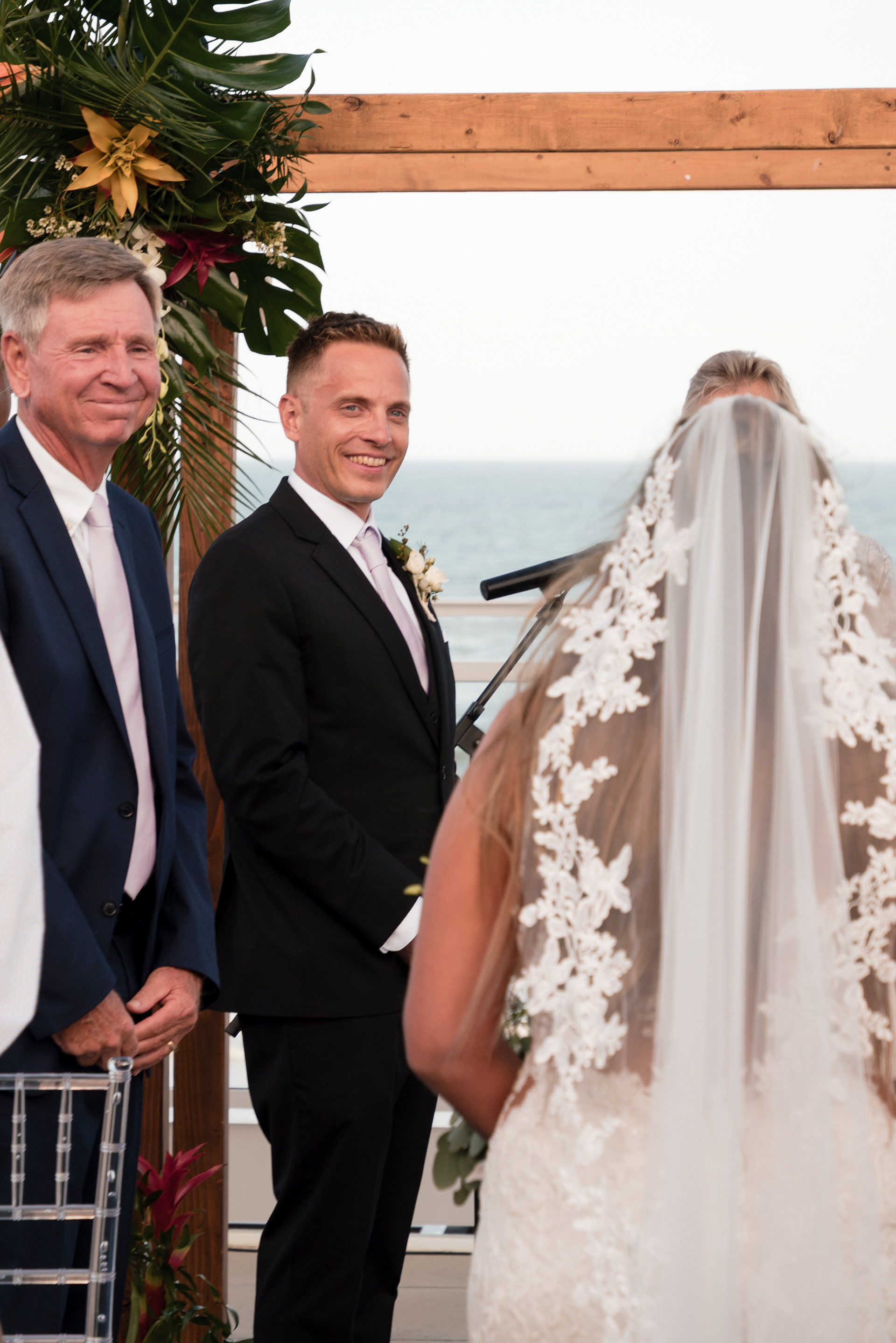 Groom watching the bride walk down the aisle during a Hard Rock Hotel Daytona Beach wedding.