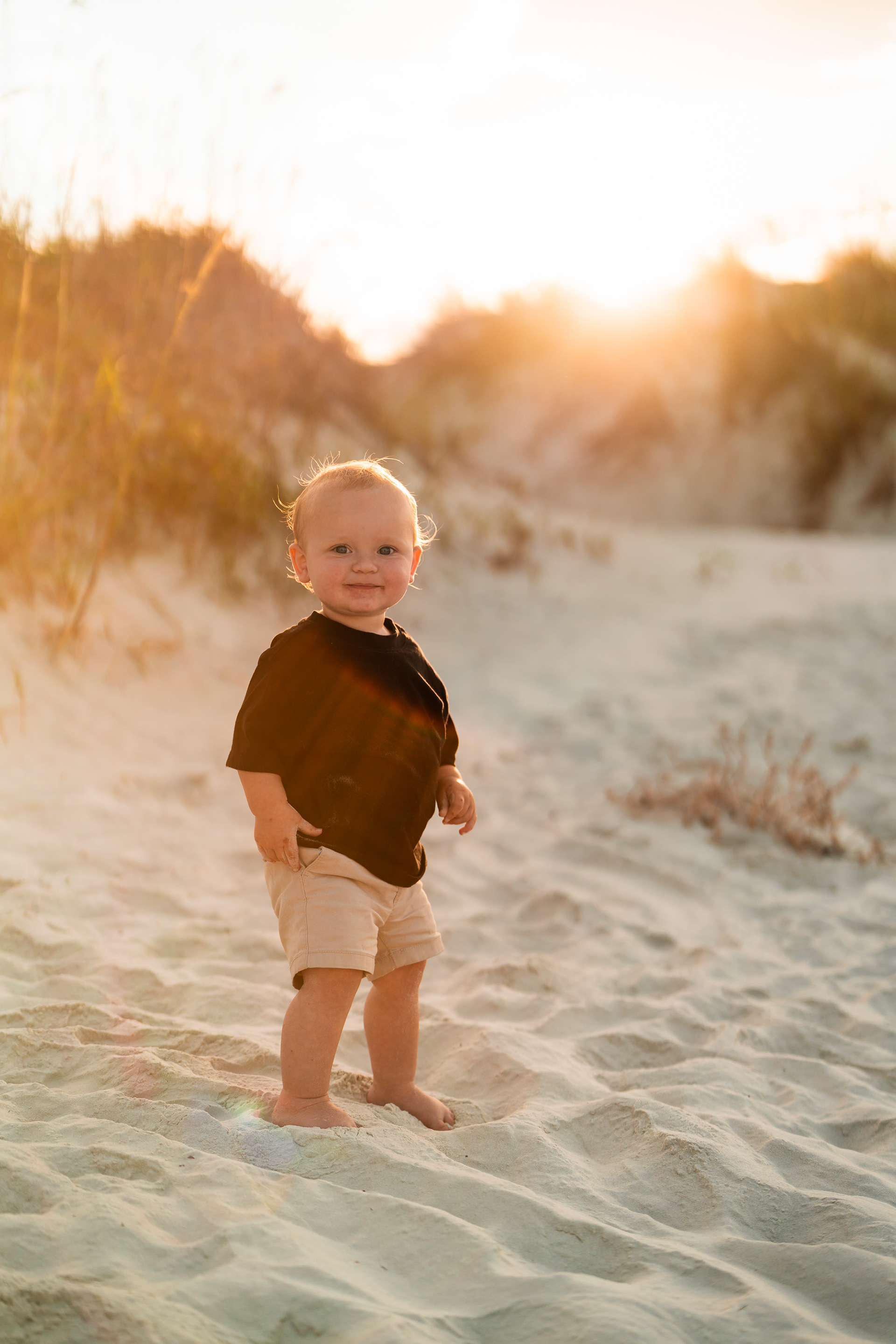Toddler portrait in the dunes during a Ponce Inlet beach family photography session.