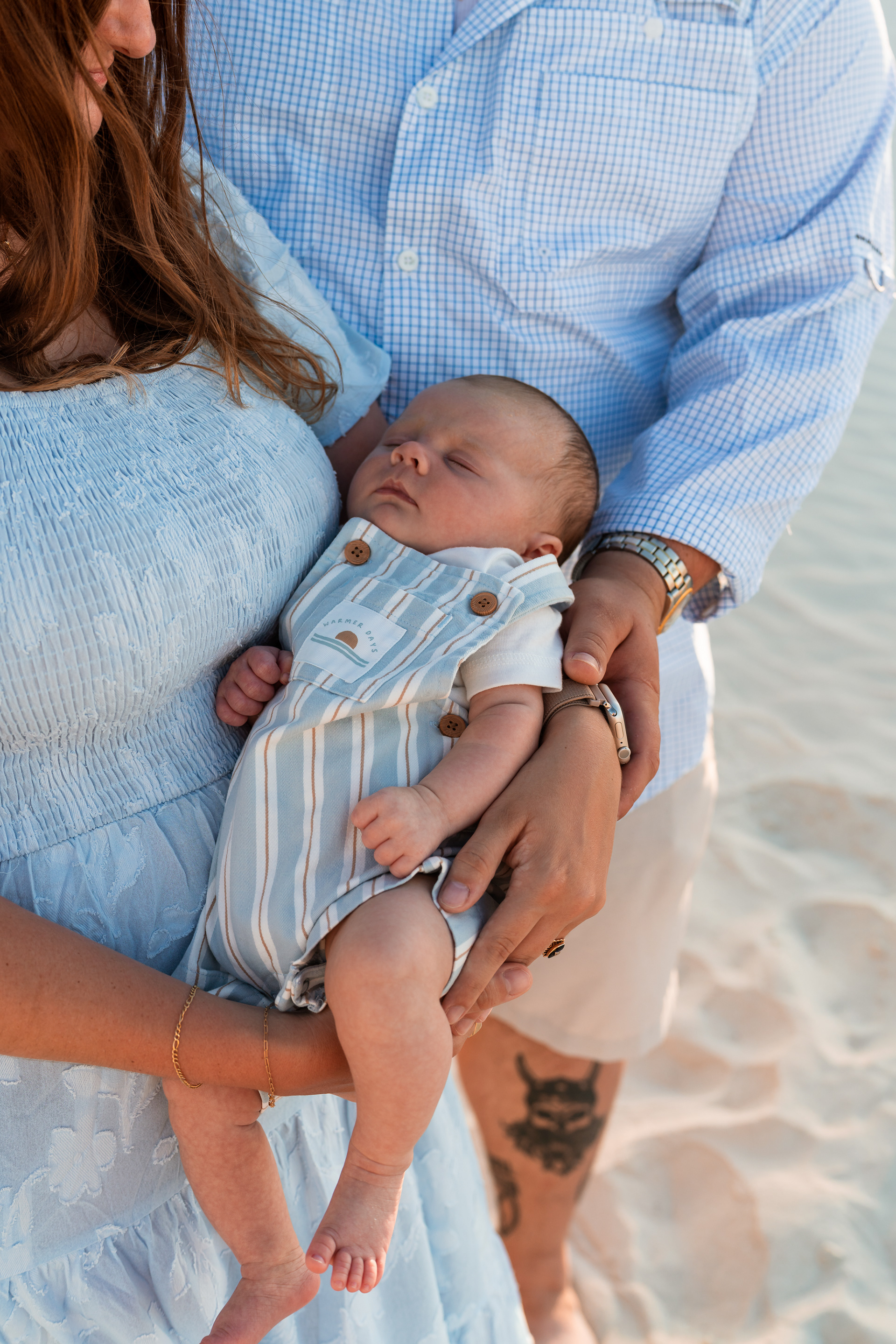 Close-up of a baby being held during a Ponce Inlet Jetty Beach family photo session.