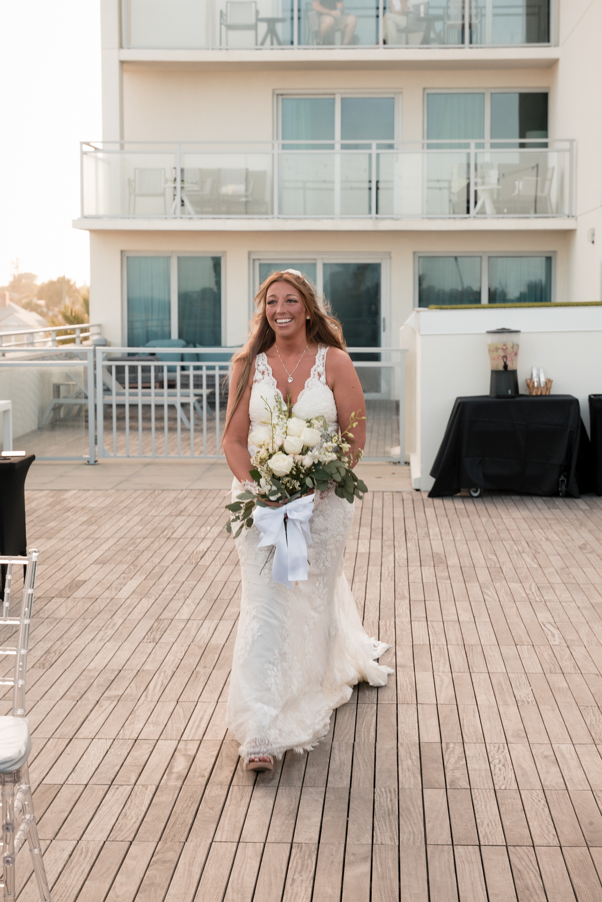 Bride walking with her bouquet before the ceremony at Hard Rock Hotel Daytona Beach.