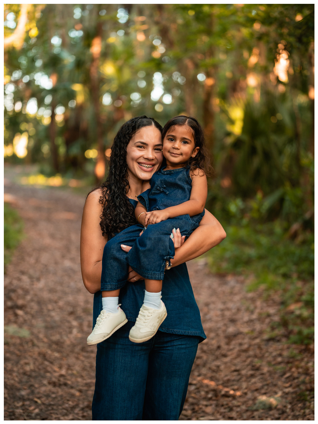 Mother and daughter portrait on wooded trail in Port Orange Florida