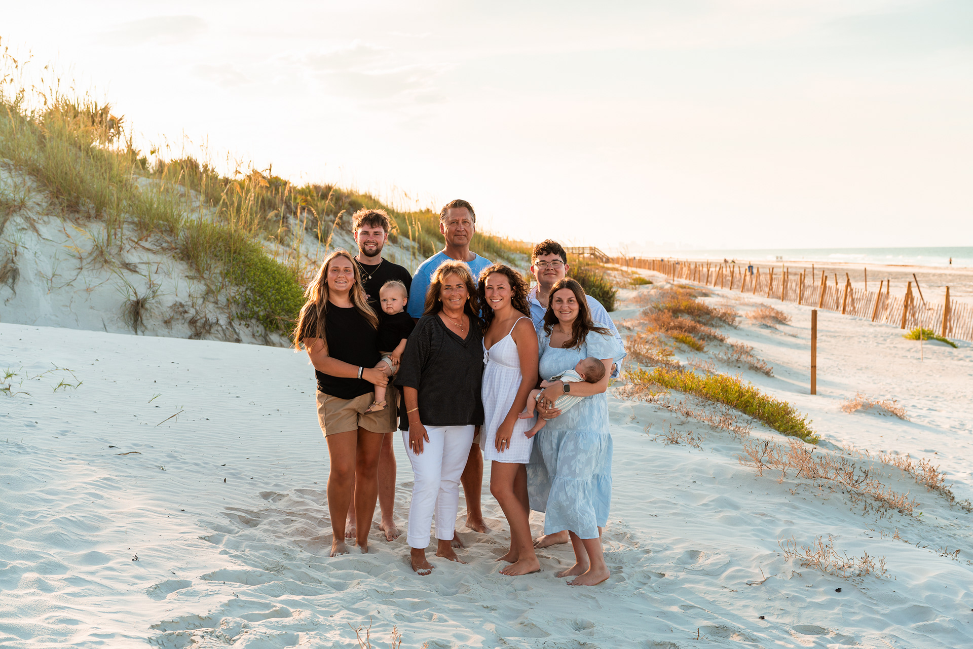 Extended family portrait in the dunes during a Ponce Inlet Jetty Beach photography session.