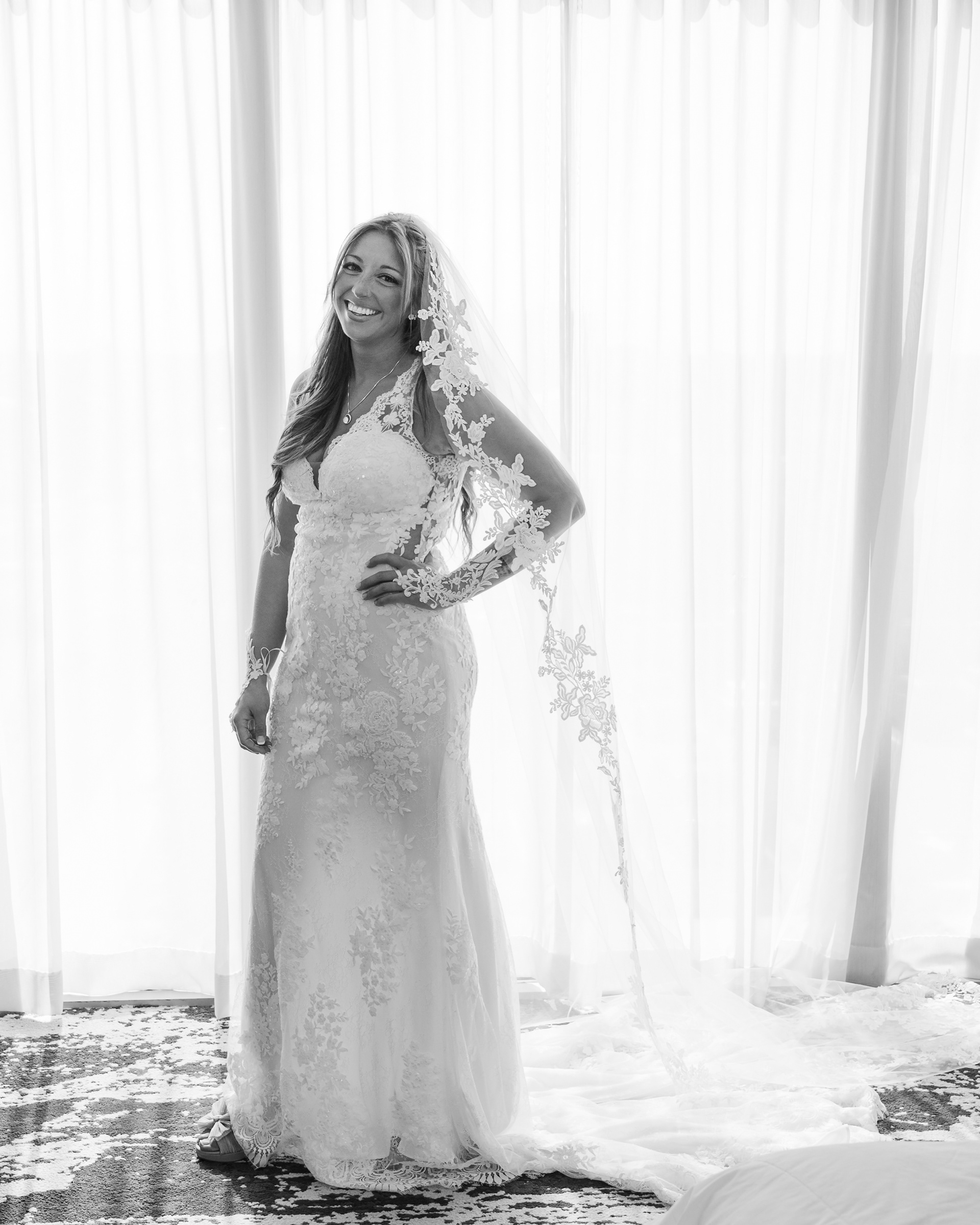 Black and white bridal portrait by the window at Hard Rock Hotel Daytona Beach.