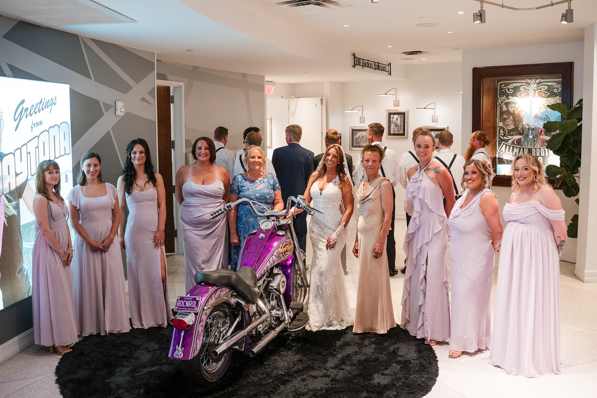Wedding party posing with the Hard Rock motorcycle at a Daytona Beach wedding.