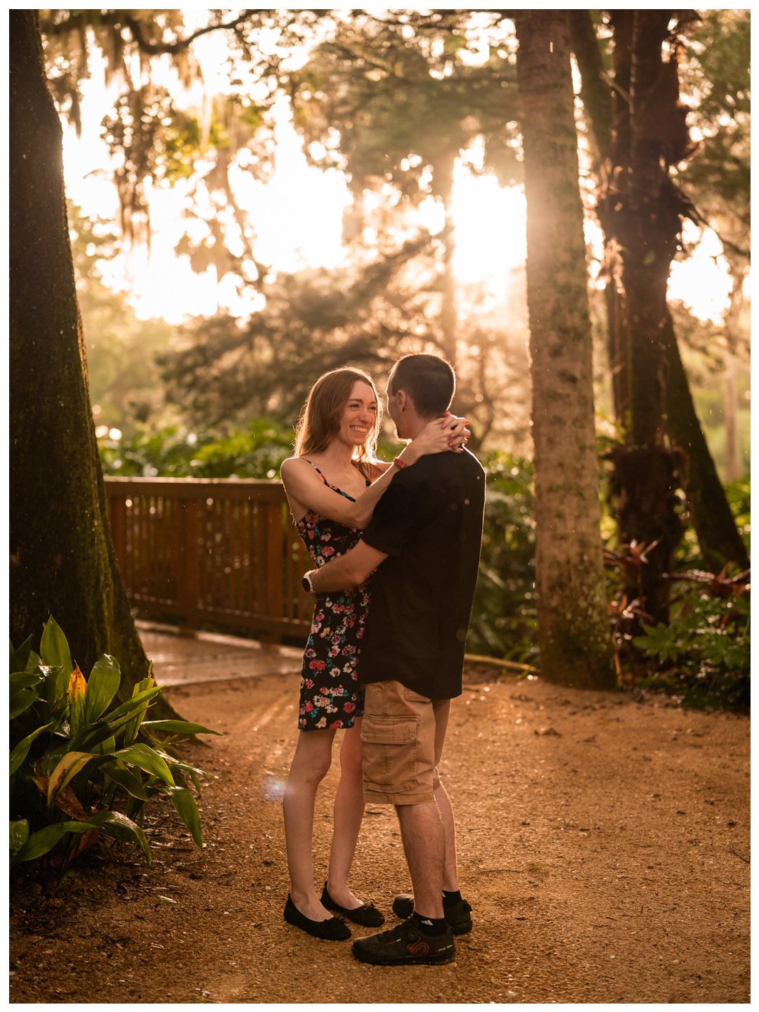 Full-length portrait of a couple embracing on a garden path at Washington Oaks State Park.