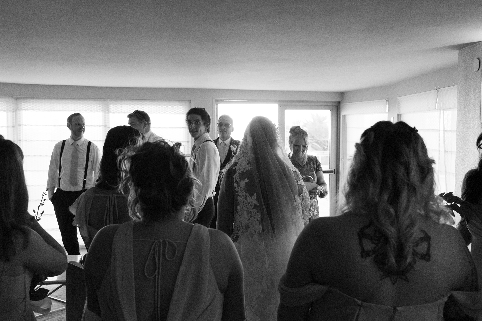 Black and white candid of guests watching the ceremony at Hard Rock Hotel Daytona Beach.