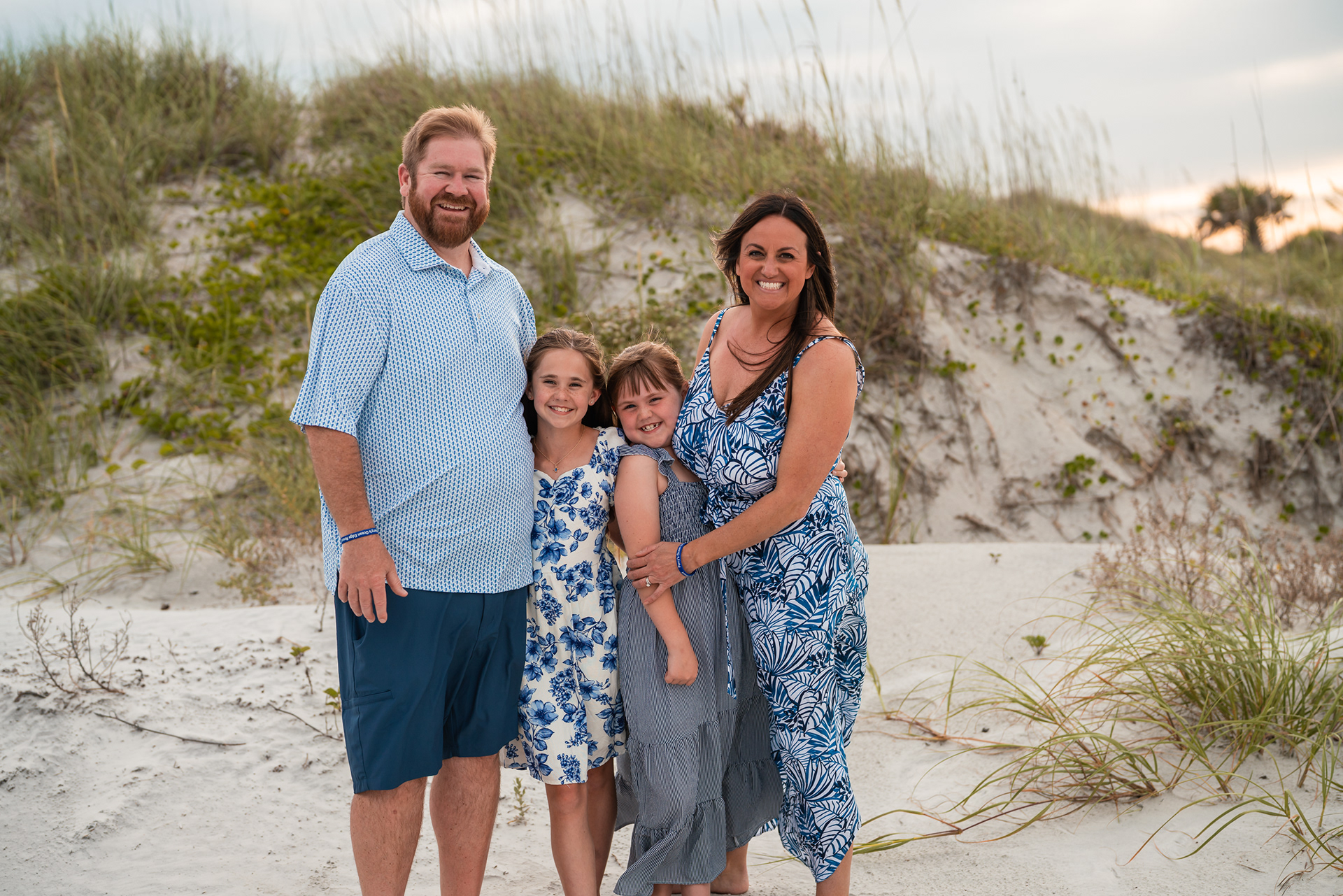 Family portrait in the dunes during a Ponce Inlet Beach family photography session.
