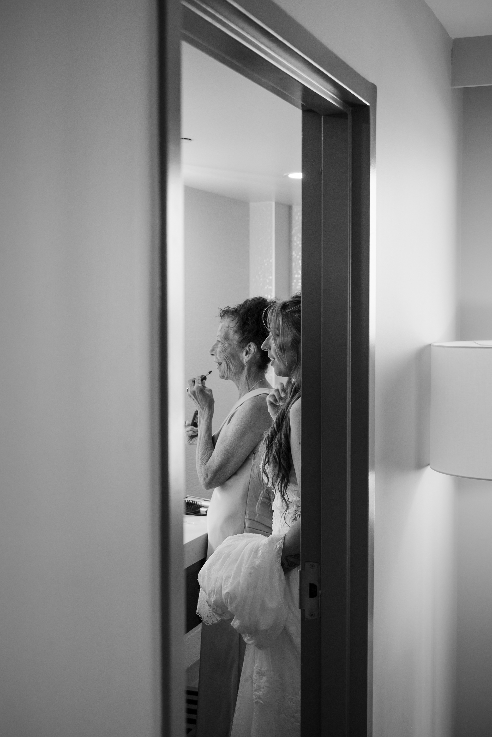 Black and white candid of the bride getting ready before her Daytona Beach wedding.
