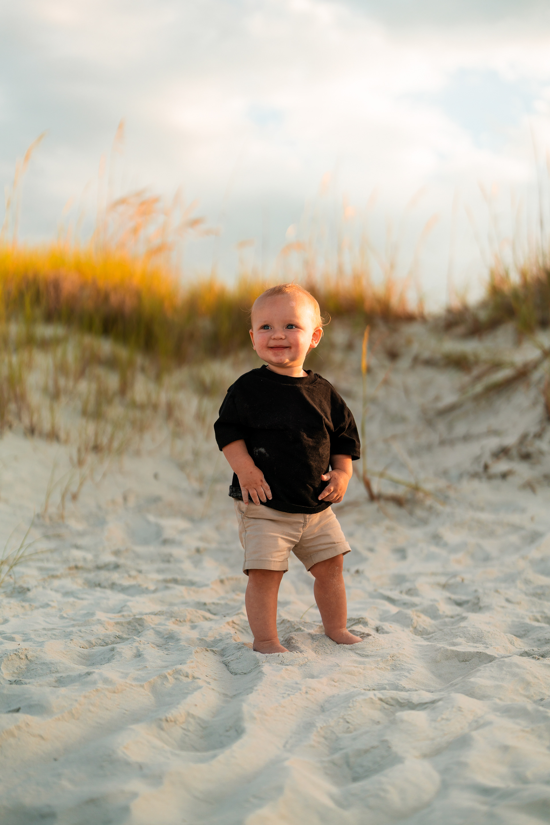 Toddler portrait in the dunes during a Ponce Inlet Jetty Beach photo session.