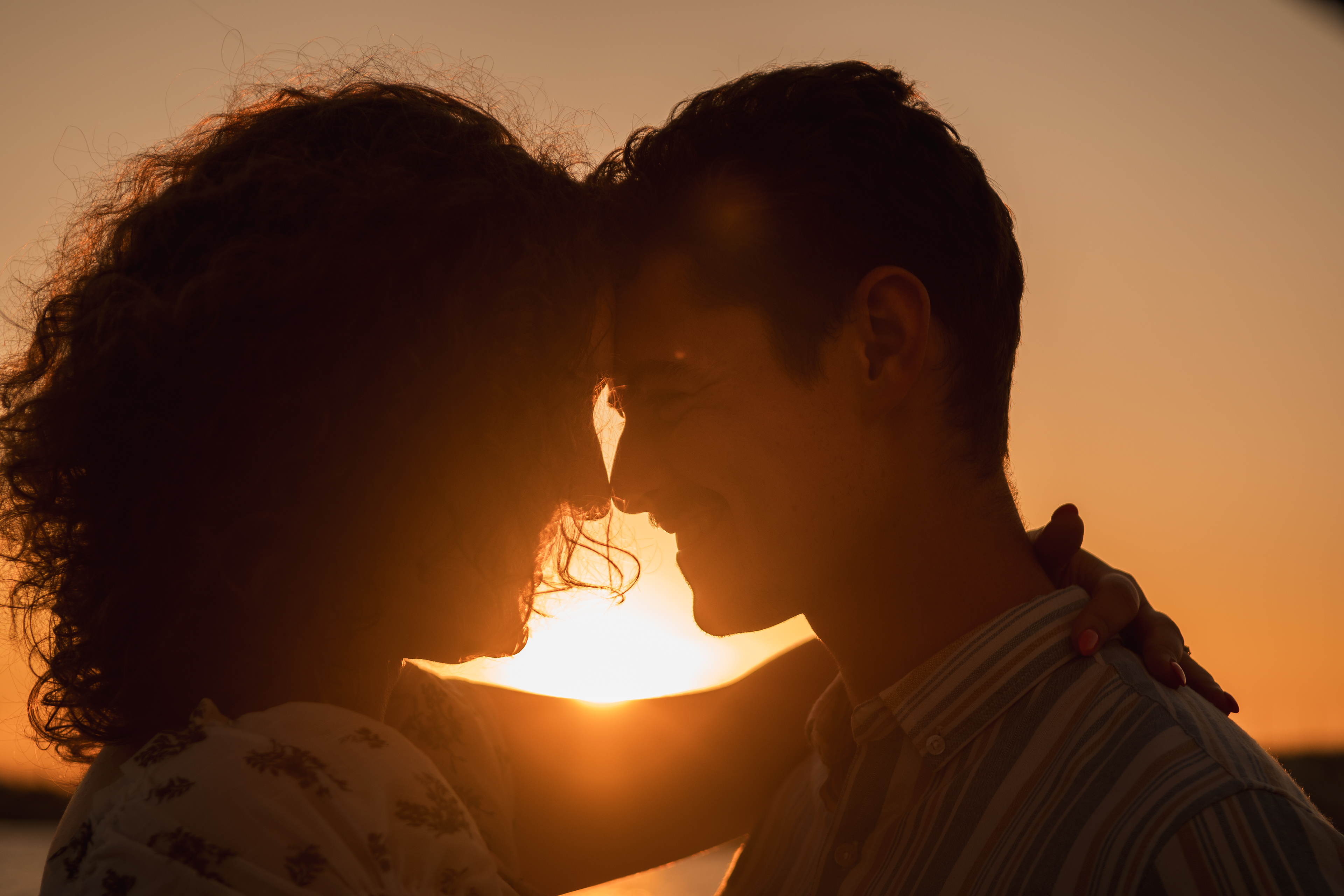Sunset engagement photos on the water in Daytona Beach