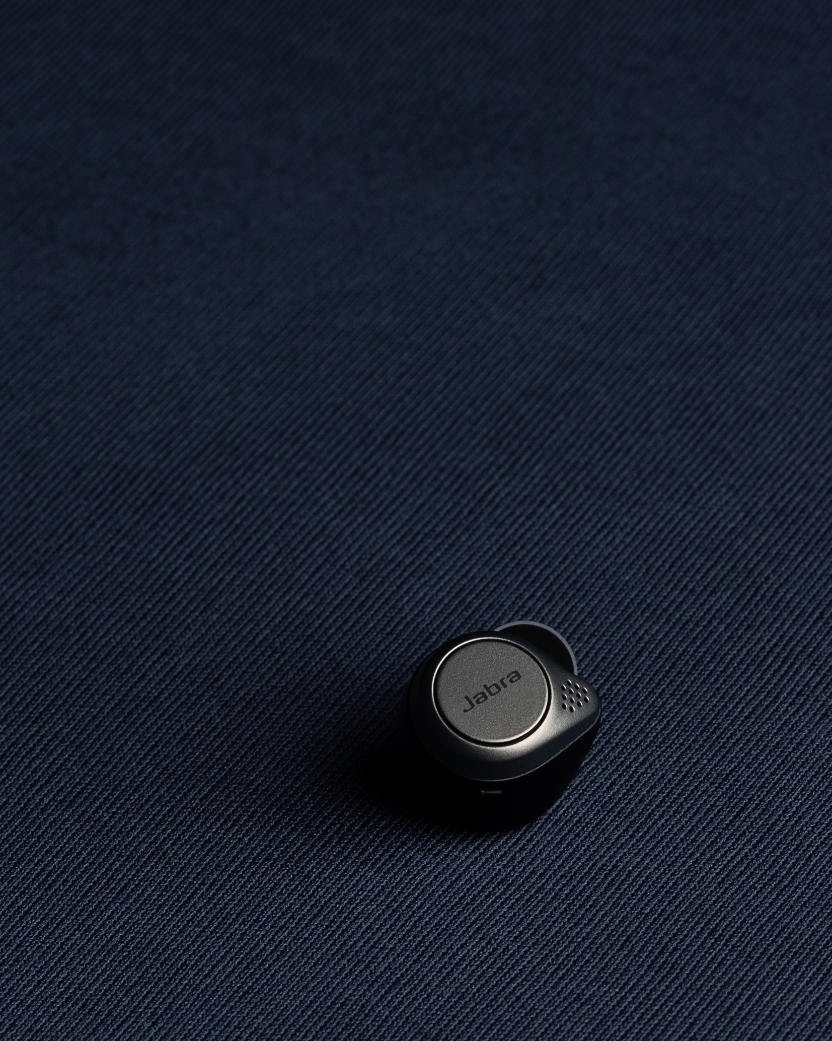  "Jabra EarPods on a sleek blue backdrop, showcasing a minimalistic design for a modern audio experience."