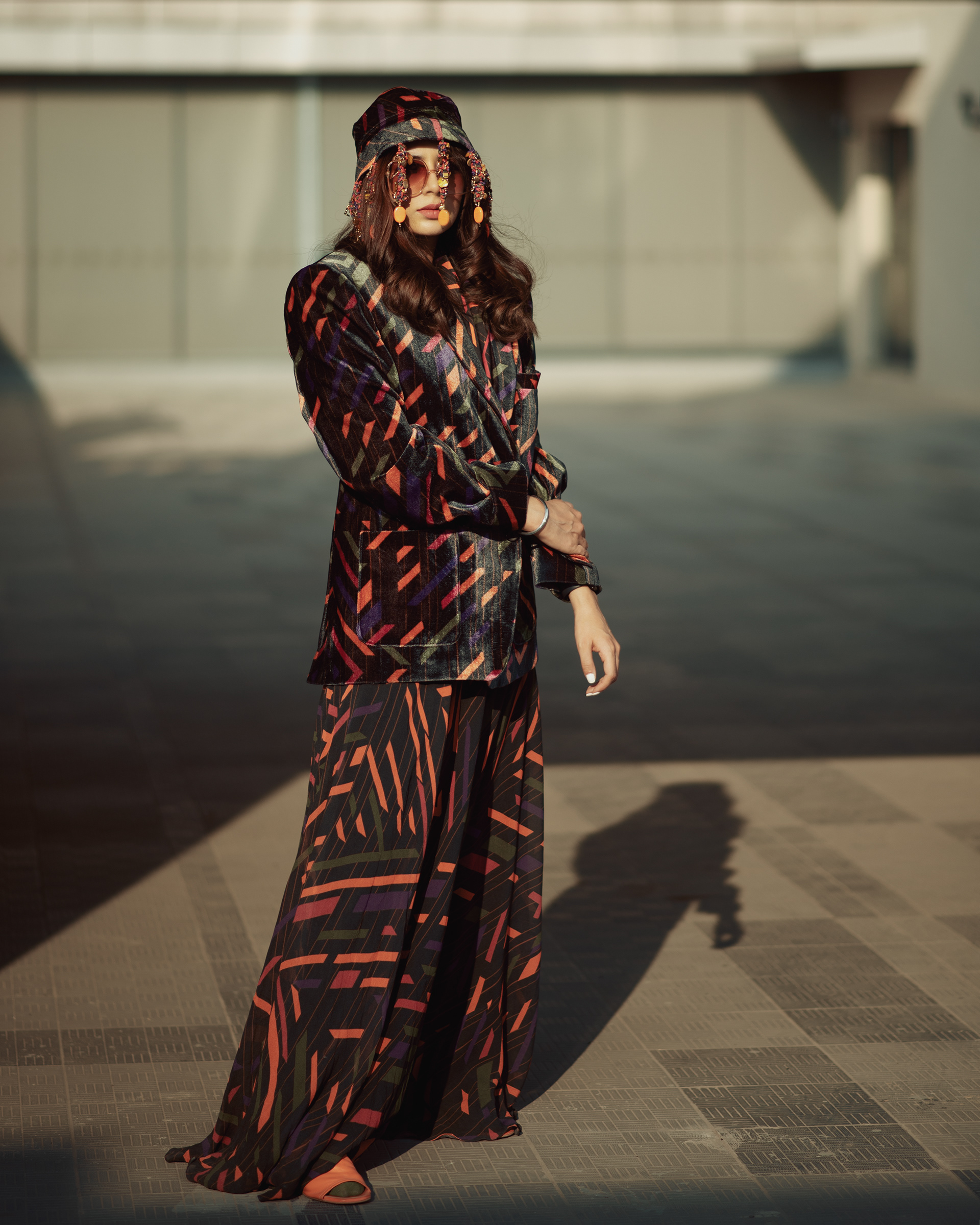 "Influencer shoot with a 'Caged Kaleidoscope' theme featuring a model wearing an elegant Nirmooha dress, showcasing a fusion of fashion and artistry."