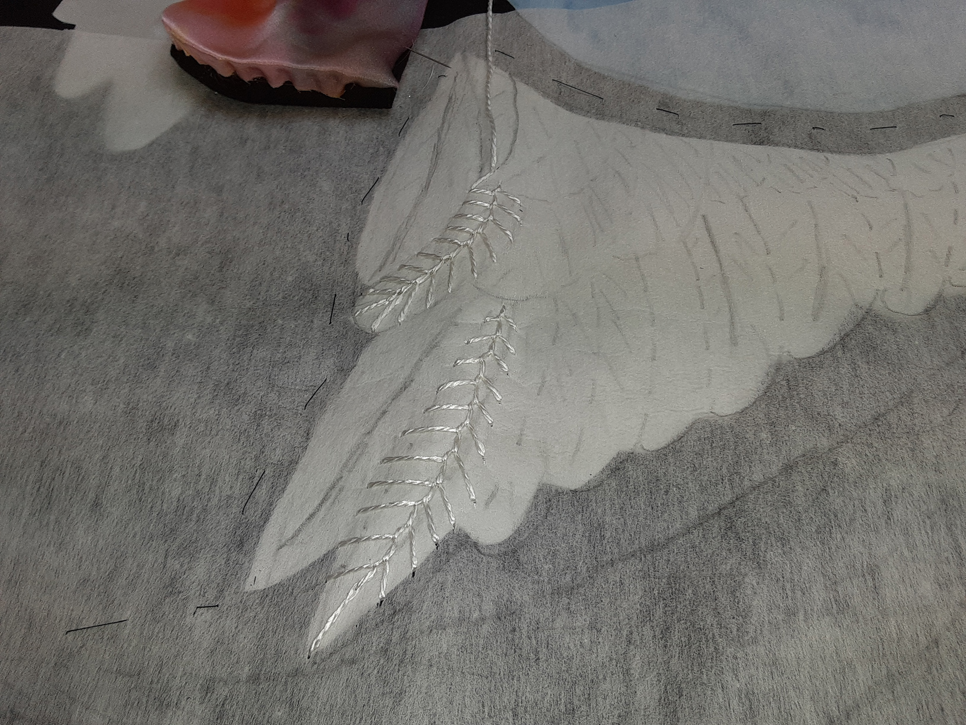 White covert feather stitching, silk embroidery thread on silk applique, using applieque tearaway for guidelines