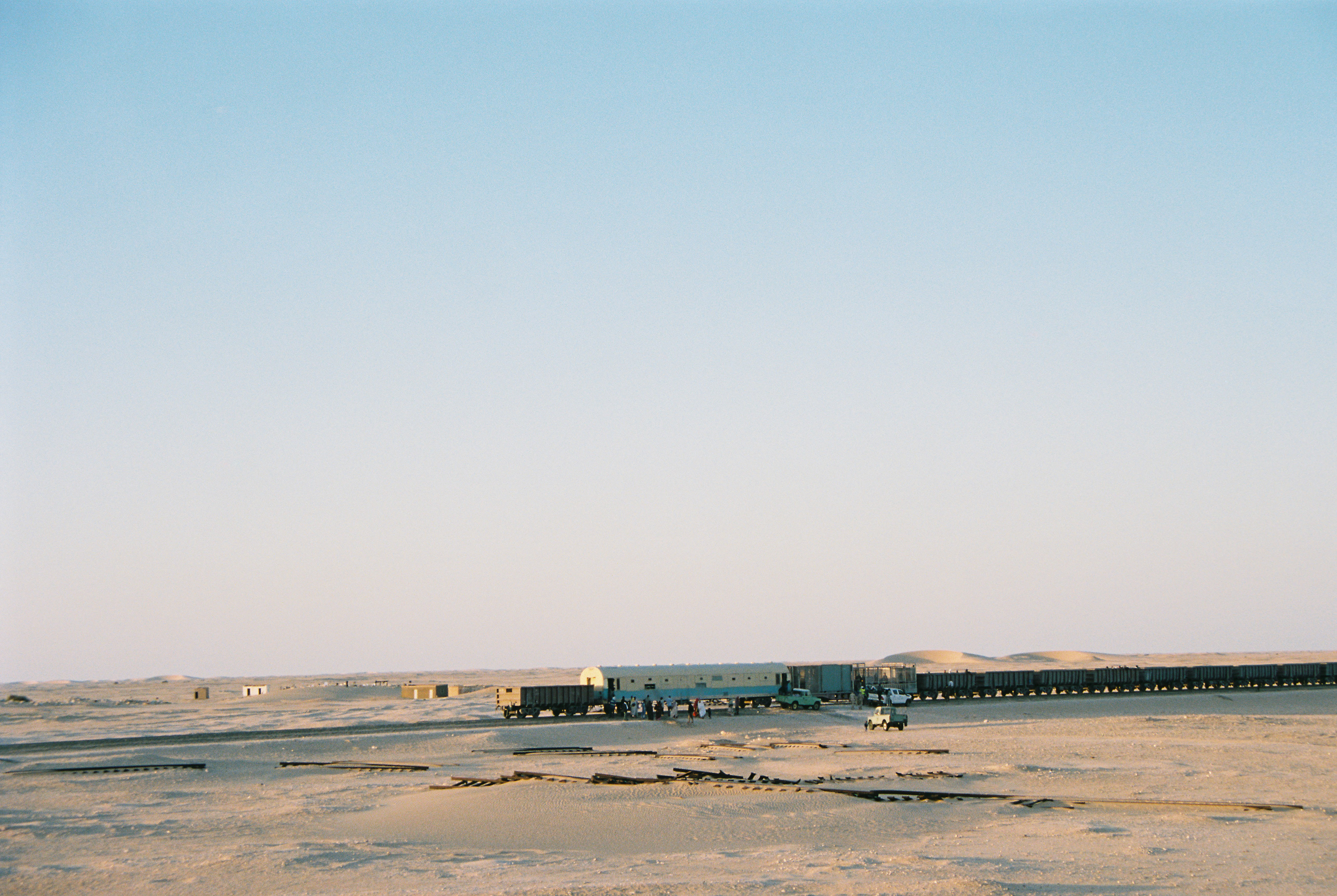 35mm: Some 16 hours in, we stopped for an hour. Across the way, the return train welcomed people aboard its passenger cabin.