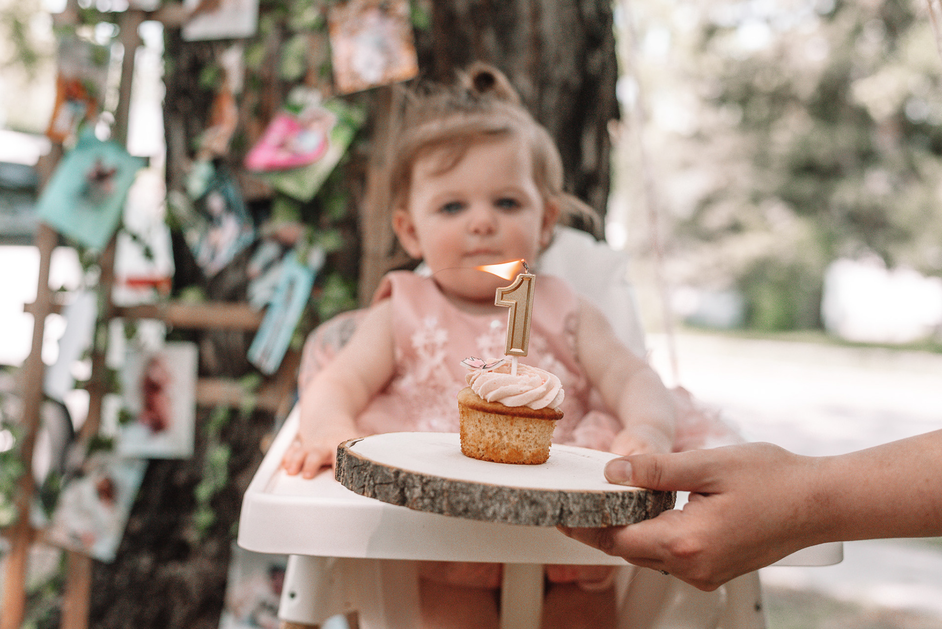 Lilly with cupcake and 'one' candle.