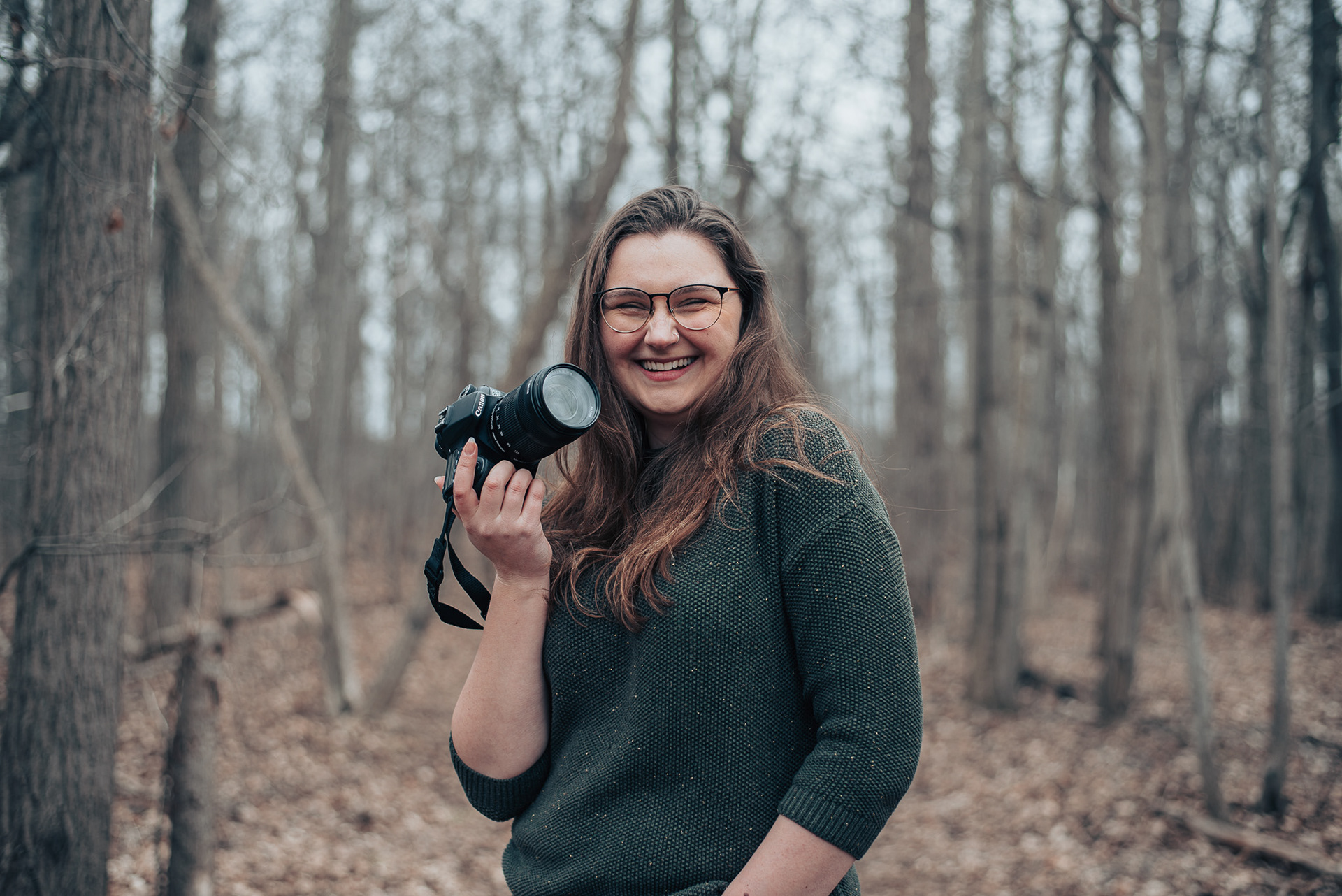 Allison laughing with her camera.
