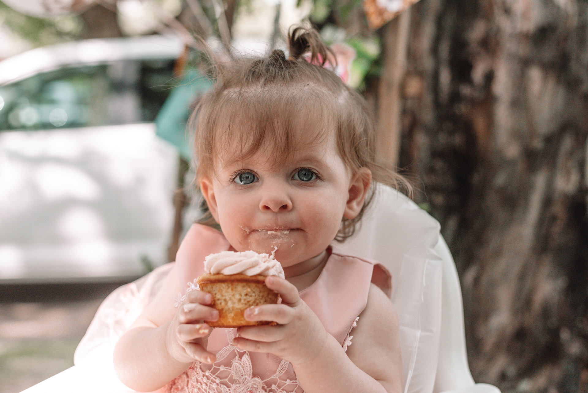 Lilly eating a cupcake.
