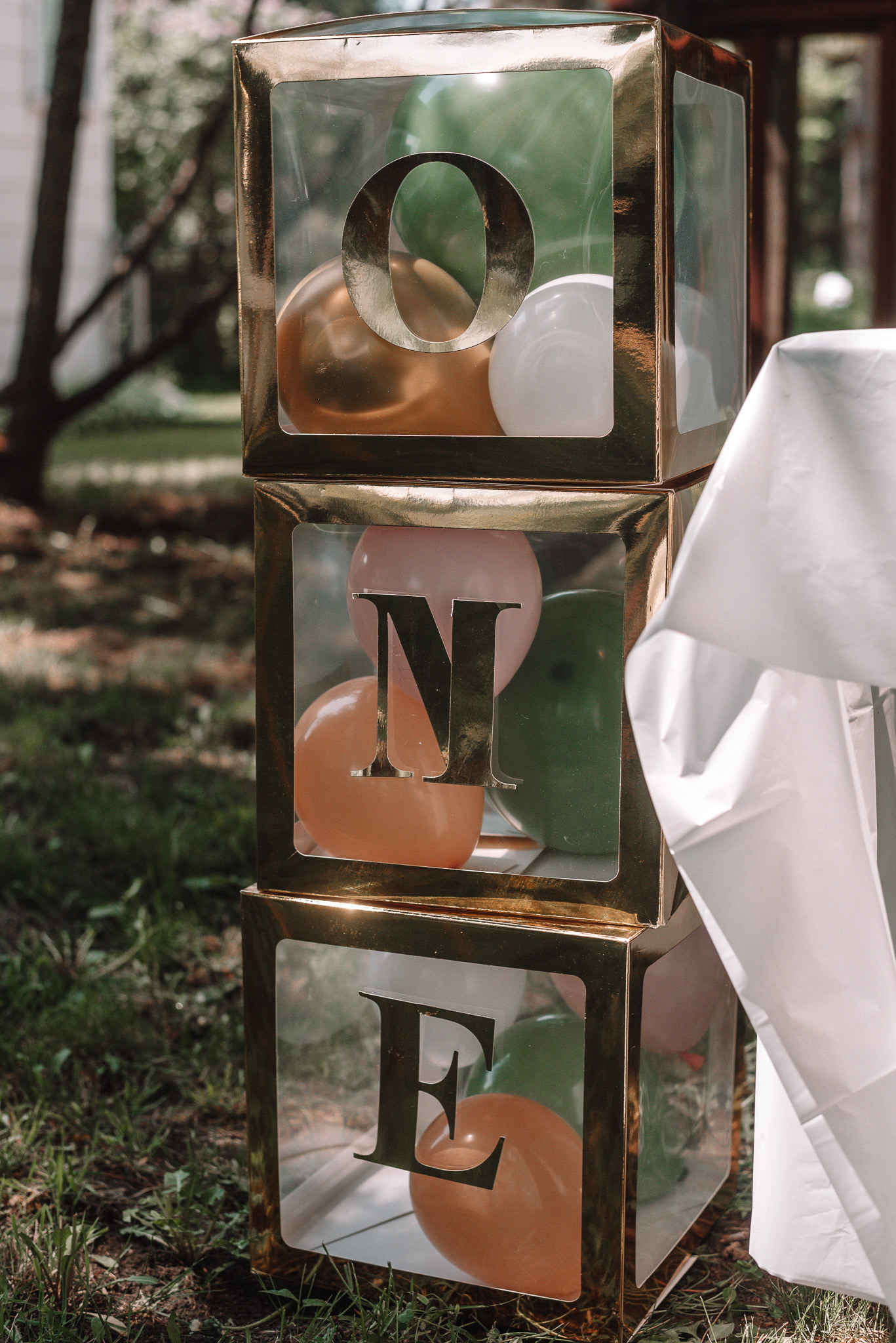 Boxes stacked with letters spelling one.