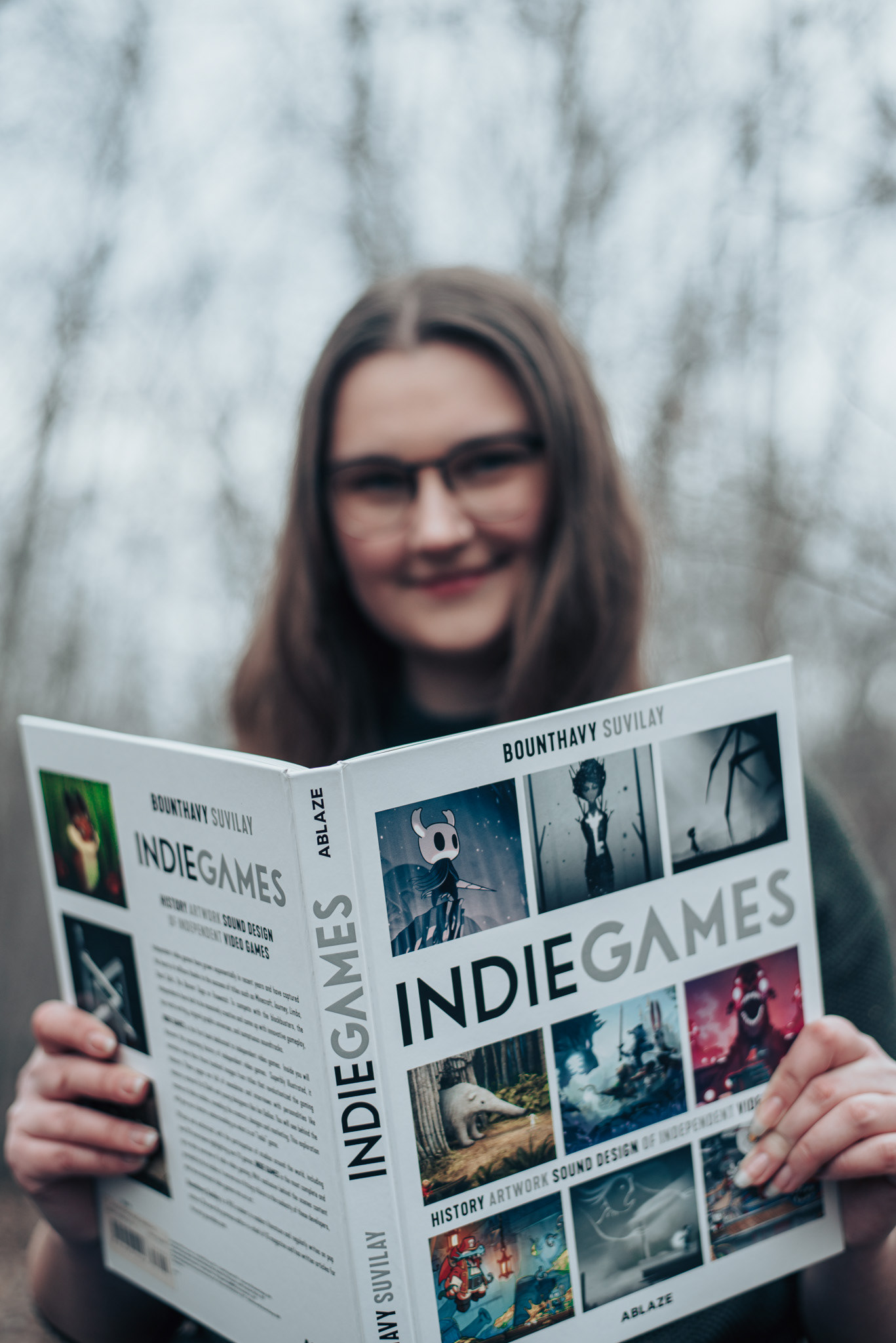 Allison reading an Indie Games book.