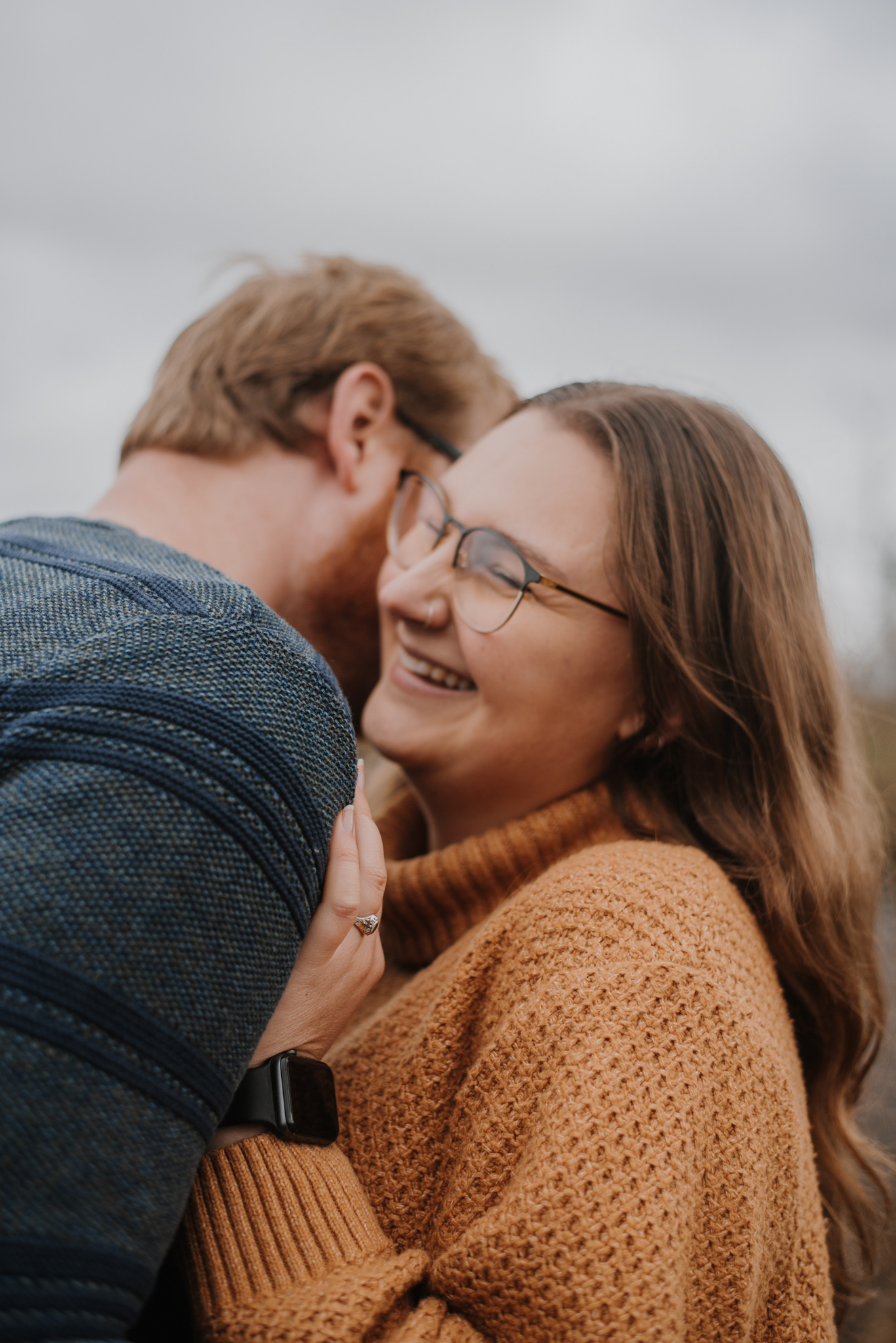 A & A snuggled up laughing.