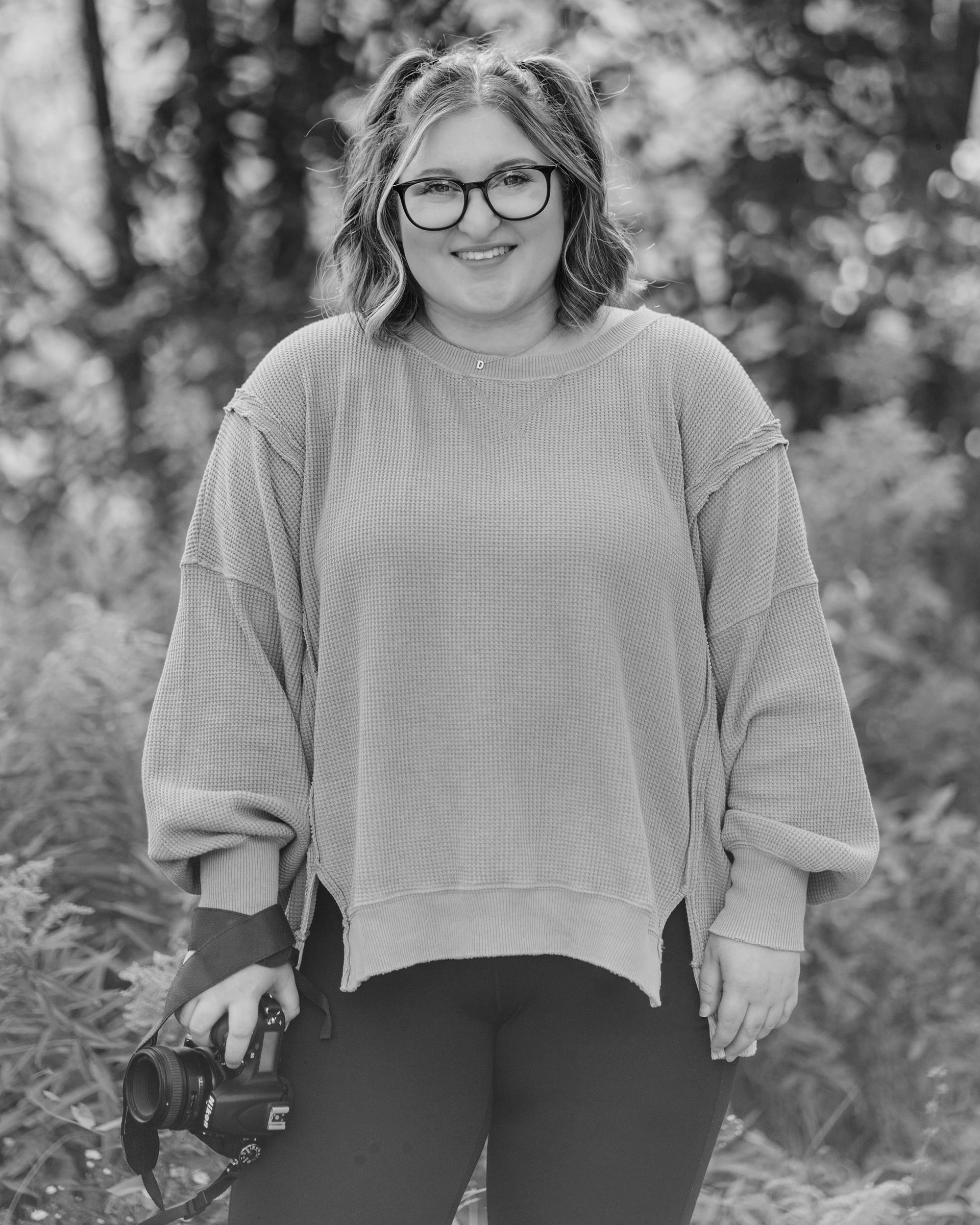 Headshot of Dahlia Levy, Graphic Designer and Photographer.