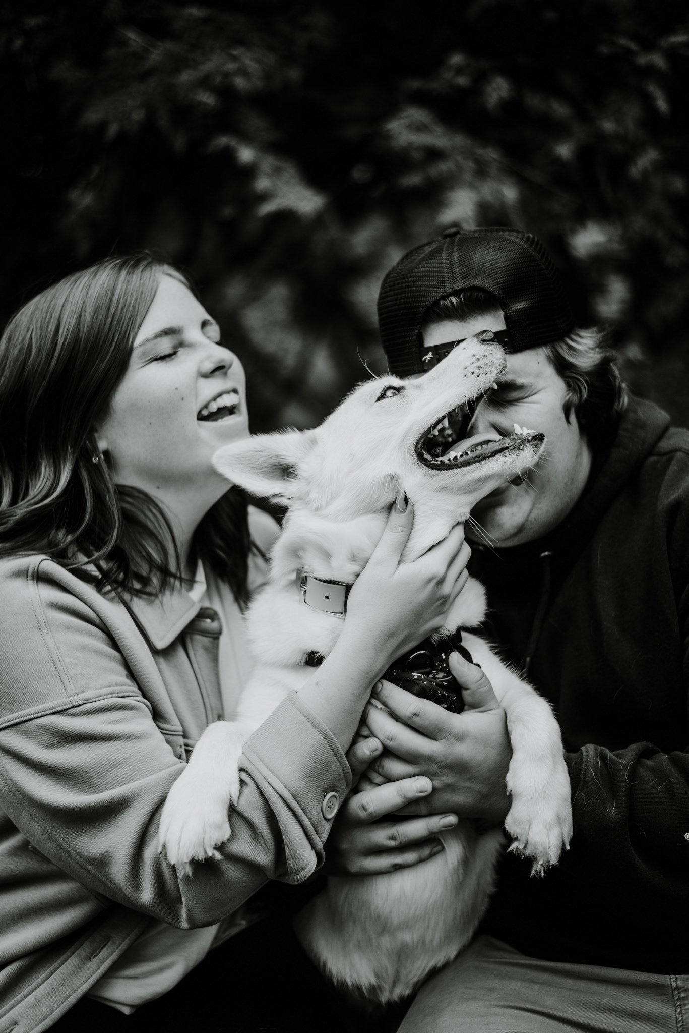 A & J laughing with dog.