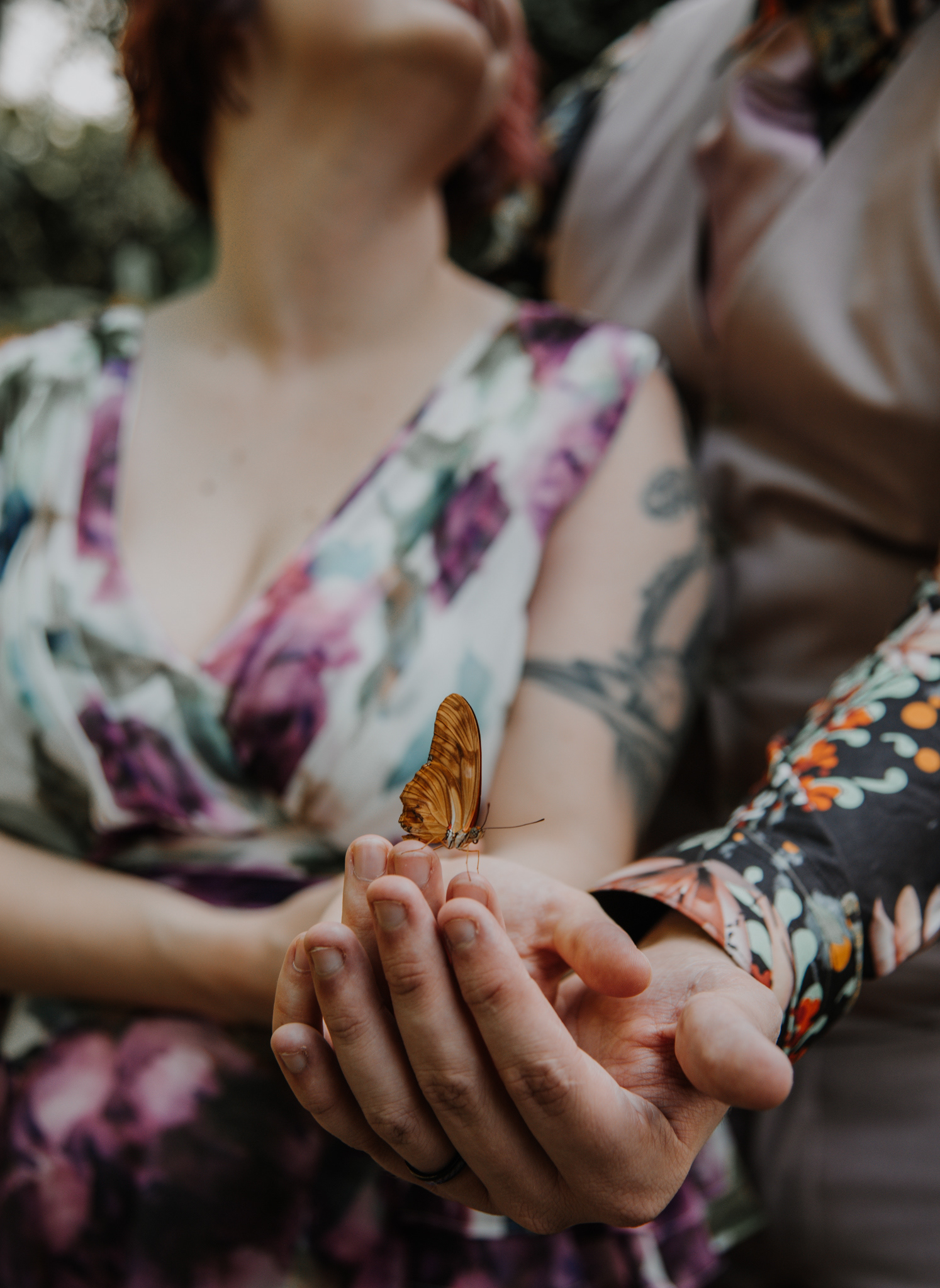 S & B holding a butterfly.