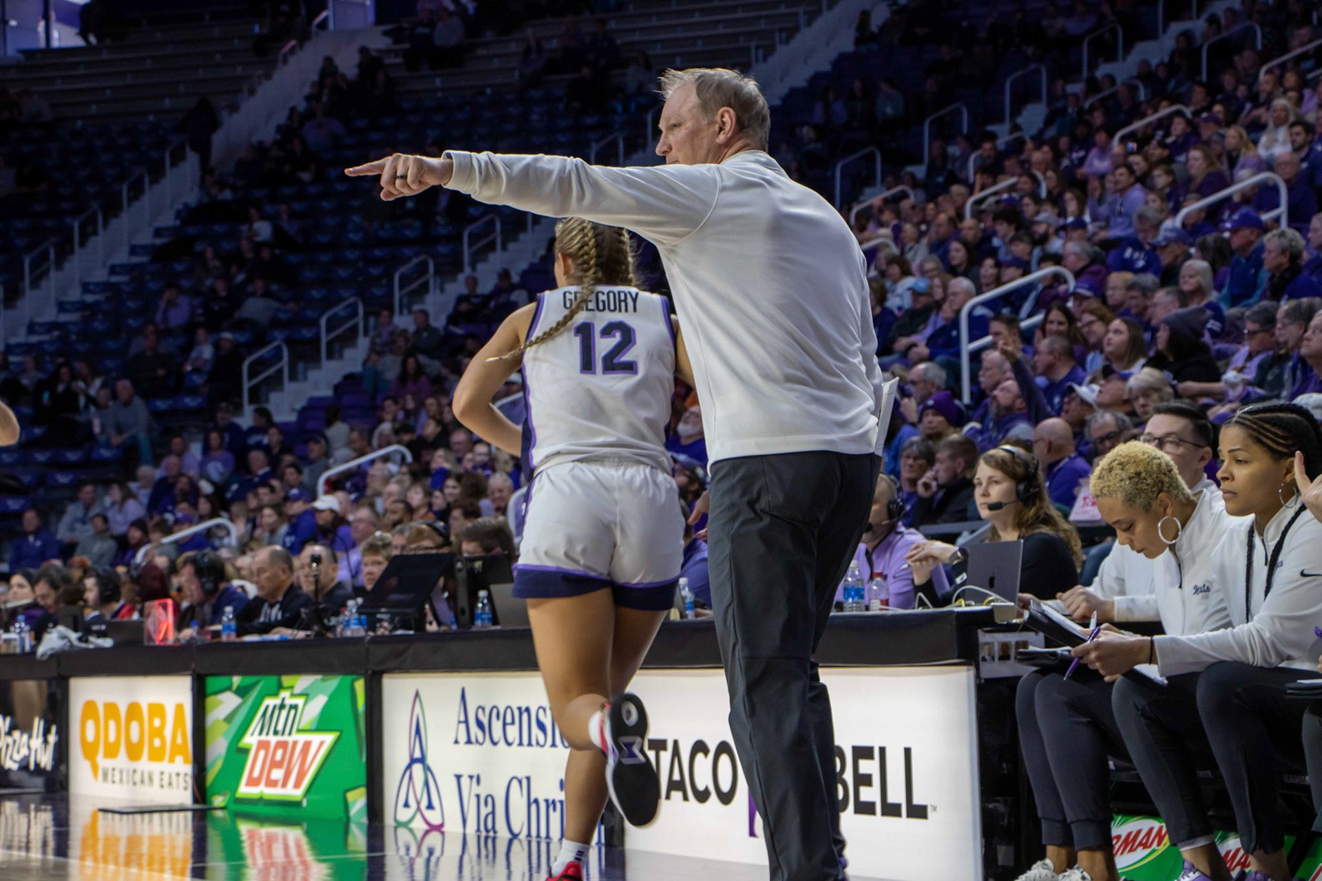 Head coach Jeff Mittie directs the offense as guard Gabby Gregory subs in at the beginning of the fourth quarter. Gregory quickly made herself known, assisting center Ayoka Lee with a layup two plays later and forcing Texas to take a timeout.