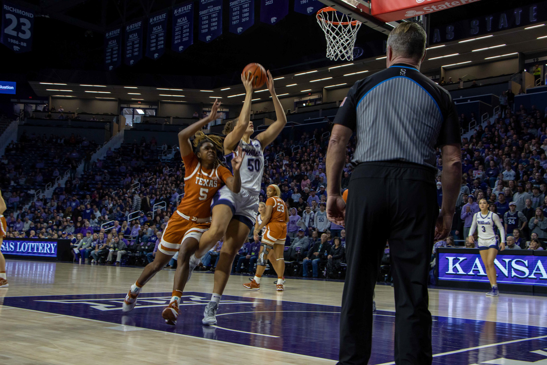 Center Ayoka Lee goes for her 2,000th career point. Although she missed this shot, she caught her rebound and went up again, drawing an and-1 and marking 2,000, the fourth women Wildcat to do so.