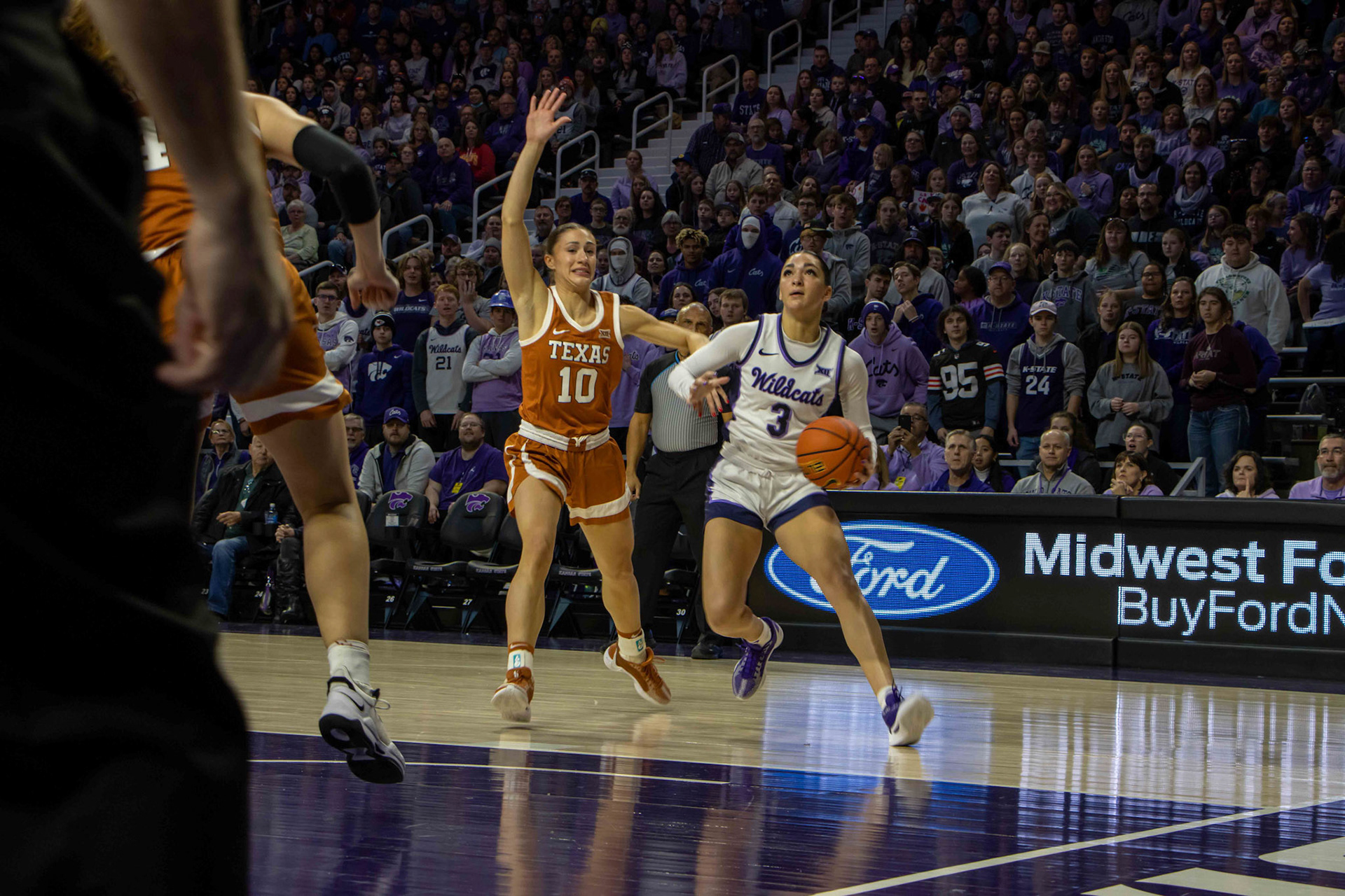 Guard Jaelyn Glenn goes for the layup in the first quarter against Texas. Texas forward Taylor Jones would deny the shot, blocking Glenn's layup.