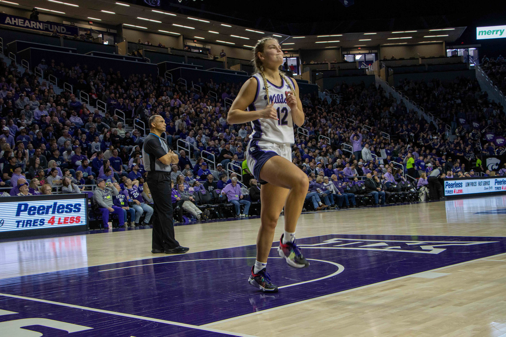 During a timeout, Gabby Gregory winces as she skips across the court, deciding if she is healthy enough to go back in. Gregory injured her ankle earlier in the third quarter against Texas.