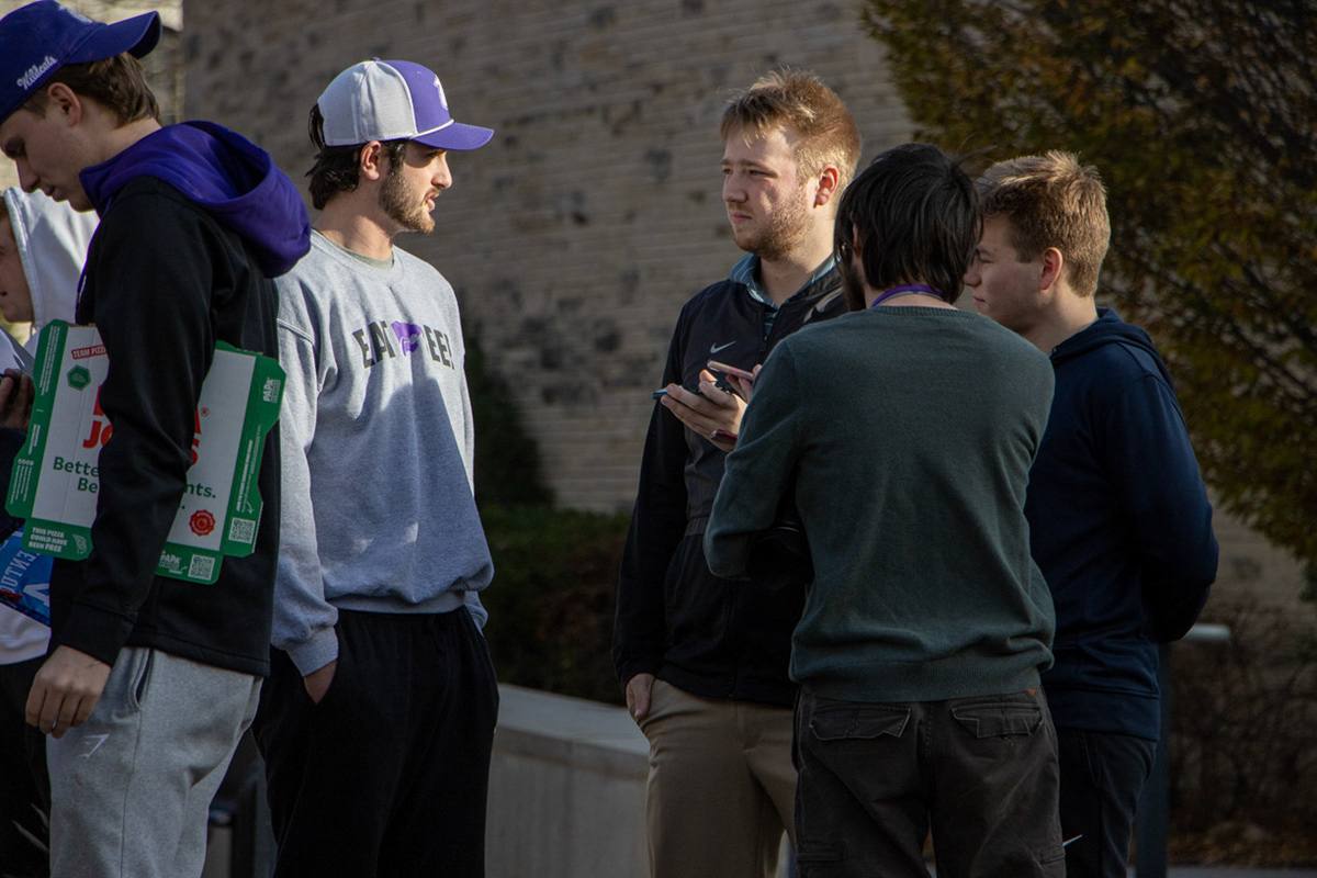 Collegian sports editor Luke Lazarczyk interviews a student in the protest for his story. Toby Hammes, on duty for the Manhattan Mercury, joins him alongside Mercury photographer Lewis Marien.