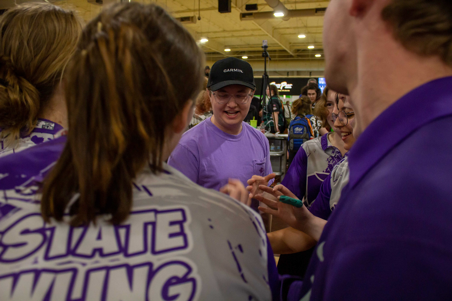 Men's bowler and former club president Cam leads his final team breakdown after the girls finished their final game of the day.