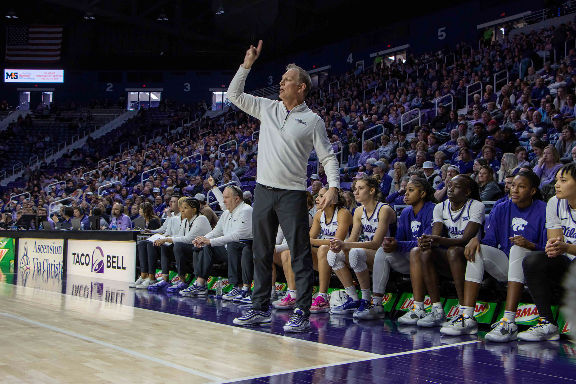 Head coach Jeff Mittie shouts directions to the offense in the fourth quarter against Texas. No. 12 K-State beat No. 10 Texas 61-58 Jan. 13, 2024.