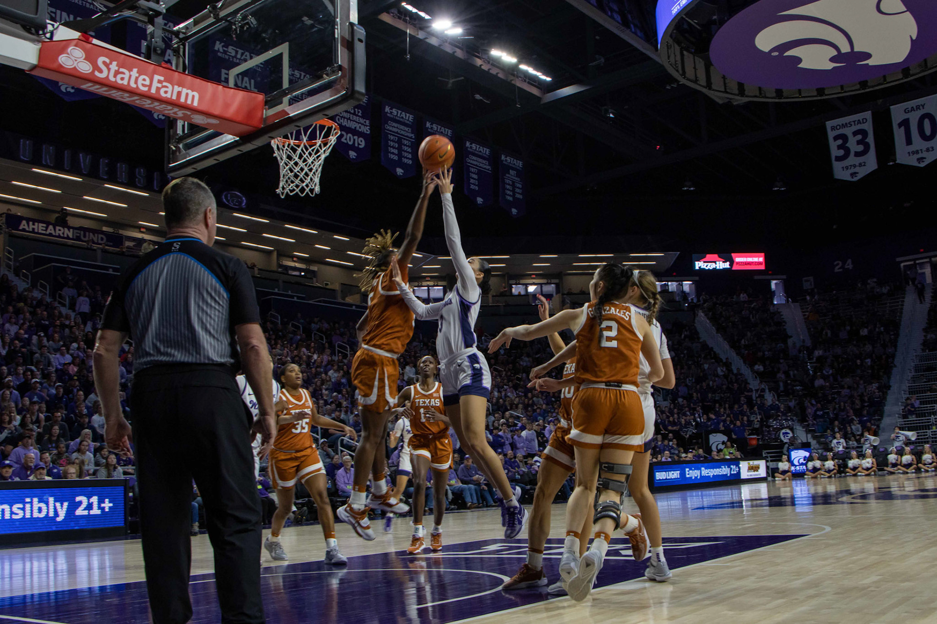 Guard Jaelyn Glenn attempts a jumper against Texas forward DeYona Gaston in the third quarter against Texas. Glenn scored double digits against the Longhorns with 10, six from 3-pointers.