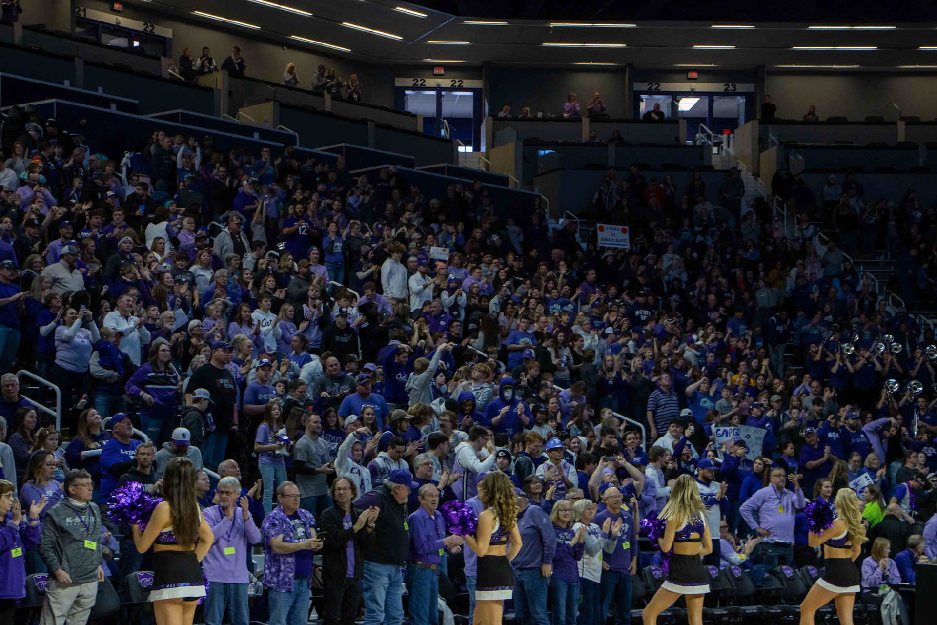 Fans celebrate after K-State sealed Texas' fate with a 61-58 win. The game had 7,000 in attendance and also marked the two millionth person to watch the K-State women's basketball team at Bramlage Coliseum.