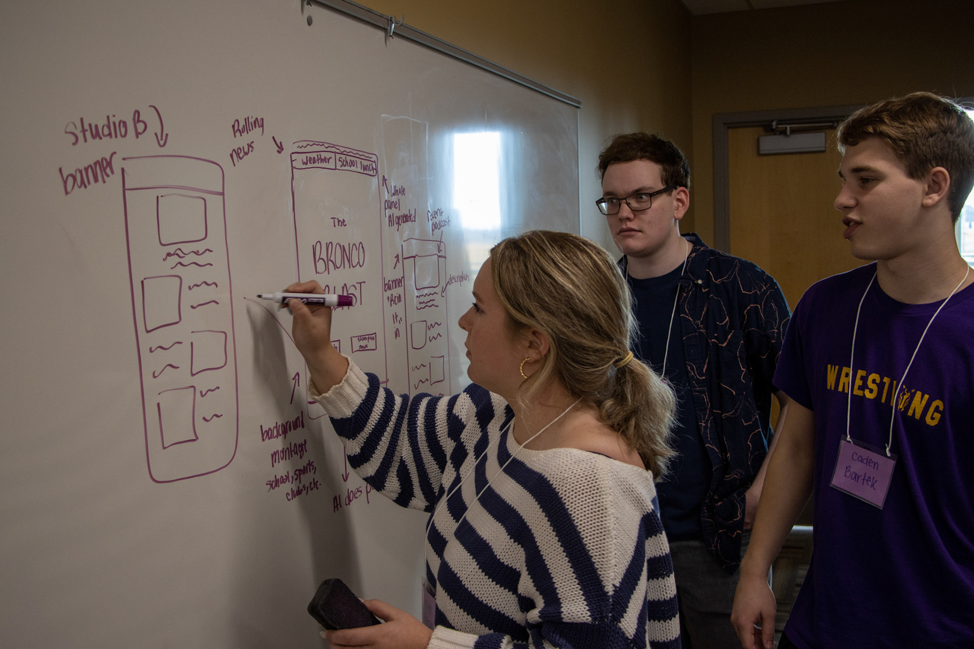 High school students create a mock-up app in a Digital Summit for Teens session at the K-State Olathe campus. Students had to find a way to integrate AI within their app. Alan Boyer, director of digital innovation programs in the A.Q. Miller School of Media and Com- munication, said he plans to continue growing the summit in Olathe and extend to Salina.