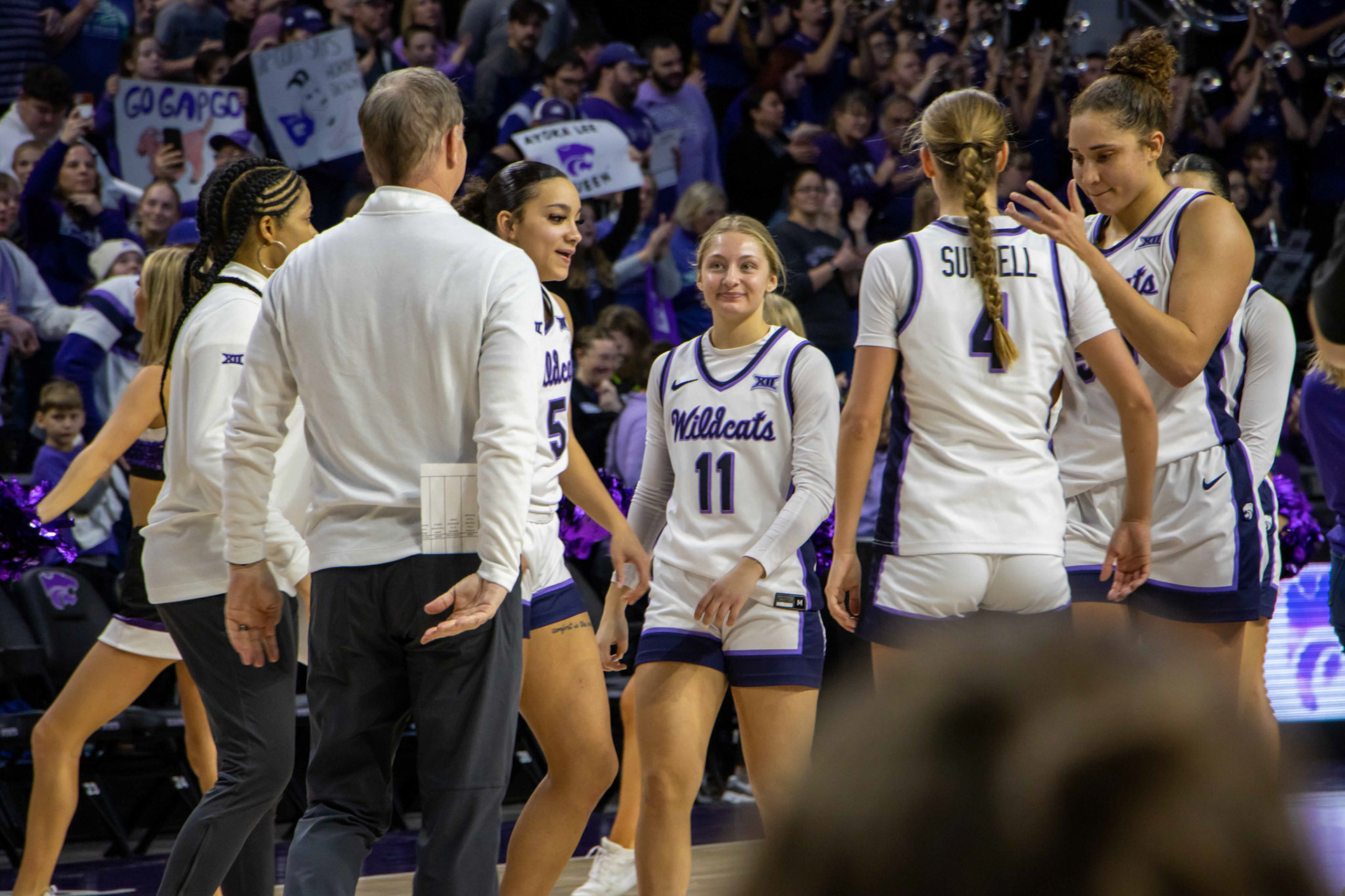 Guard Taryn Sides makes her way to the huddle following K-State's win. No. 12 K-State beat No. 10 Texas 61-58 Jan. 13, 2024.