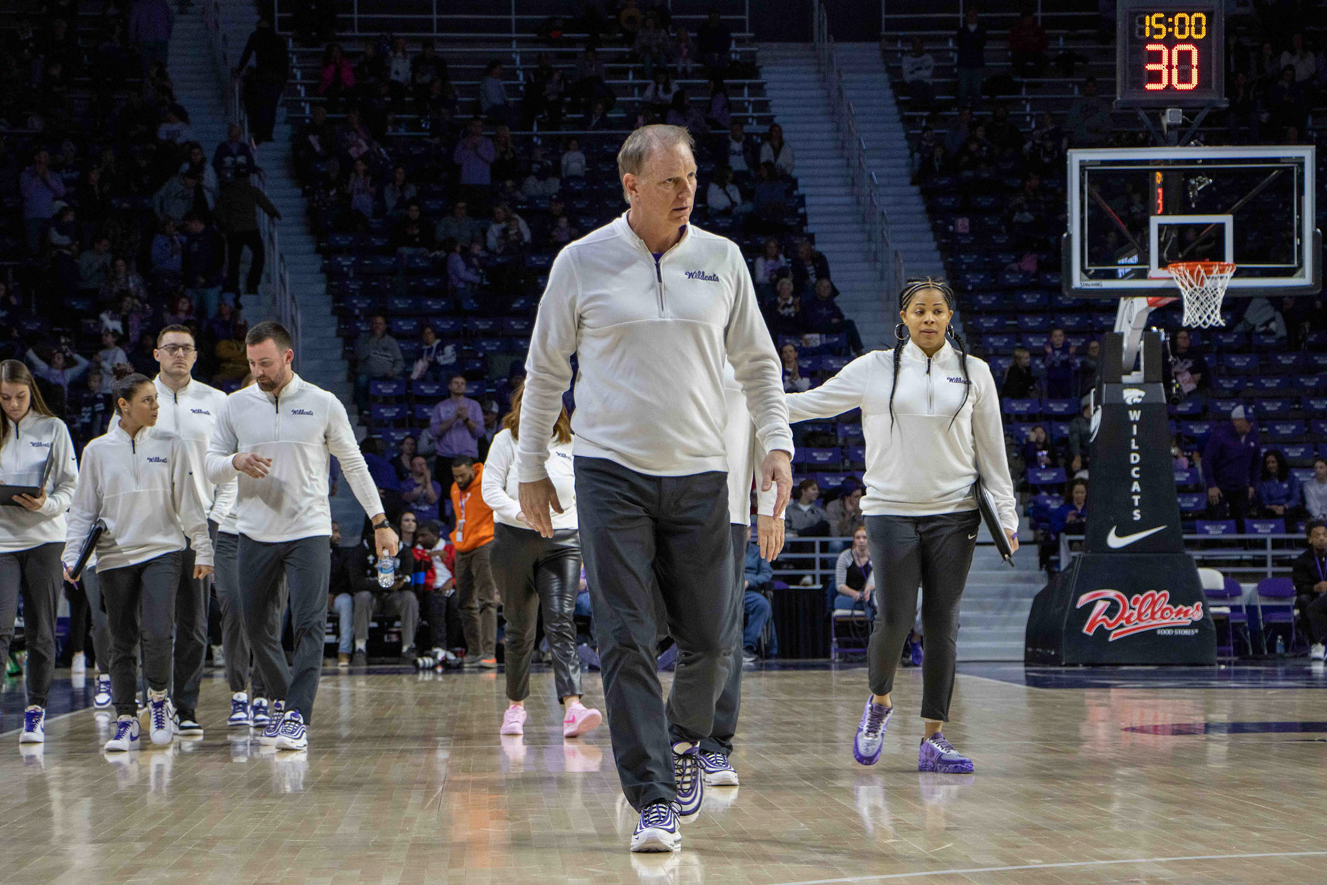 Head coach Jeff Mittie walks to the locker room at halftime. No. 12 K-State trailed No. 10 Texas 31-30 at the end of the second quarter.