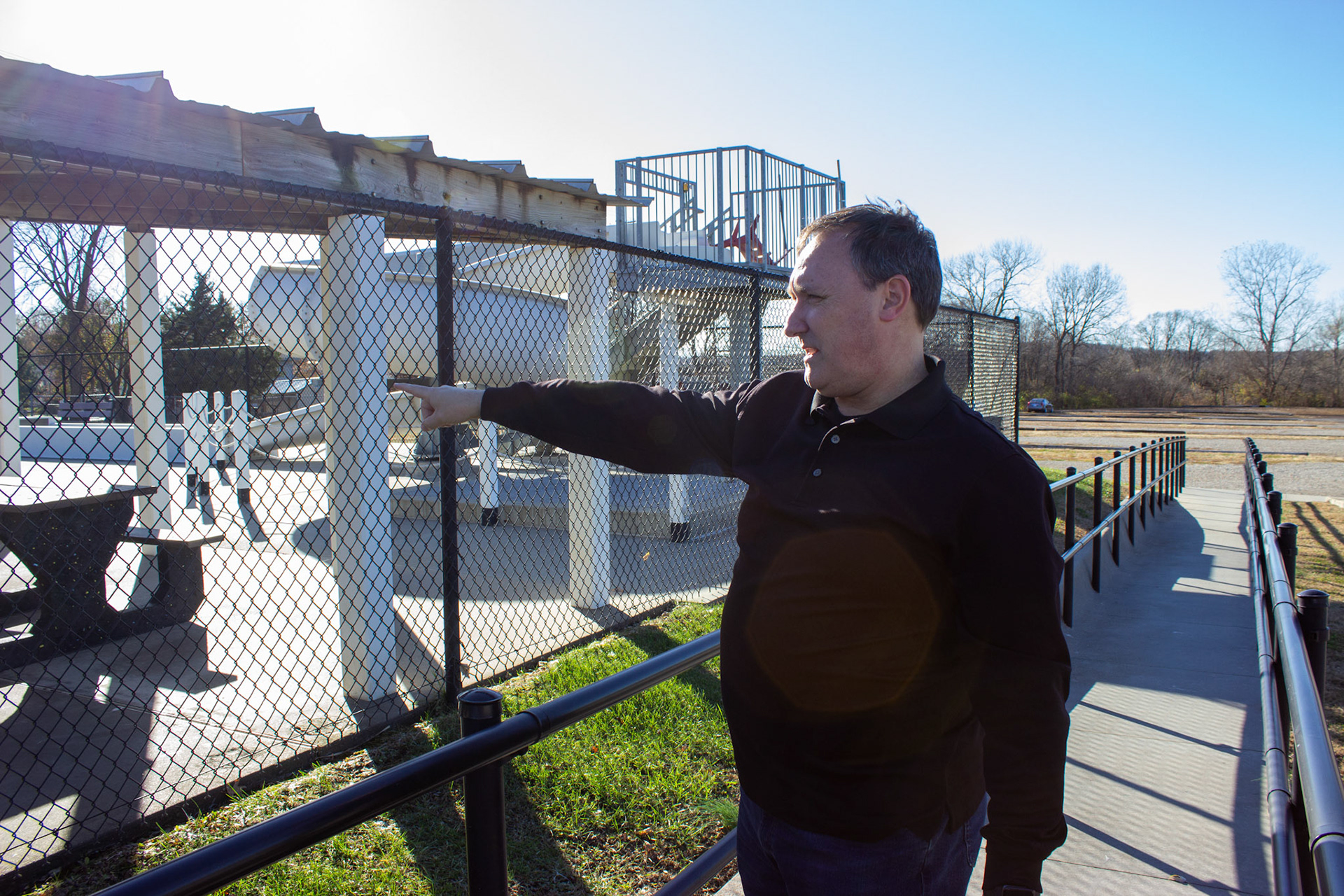 Troy points out where he lifeguarded at the Carbondale city pool.