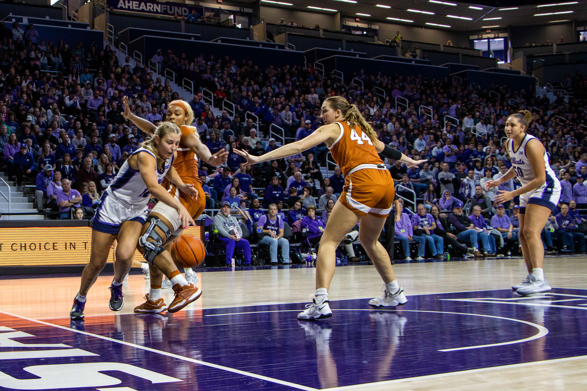 Guard Gabby Gregory dribbles under the rim trying to open something up. No. 12 K-State beat No. 10 Texas 61-58 Jan. 13, 2024.