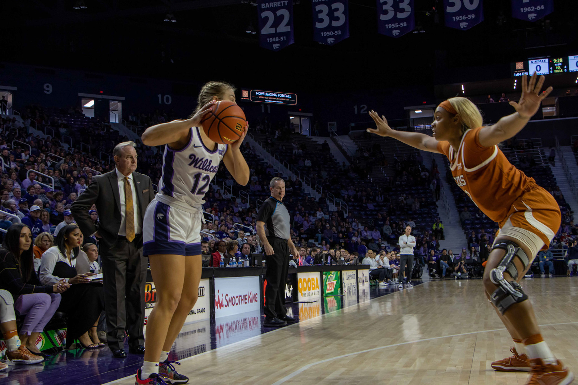 Guard Gabby Gregory looks to pass against Texas forward Aaliyah Moore. The play ended with a made 2 from center Ayoka Lee in K-State's 61-58 victory.