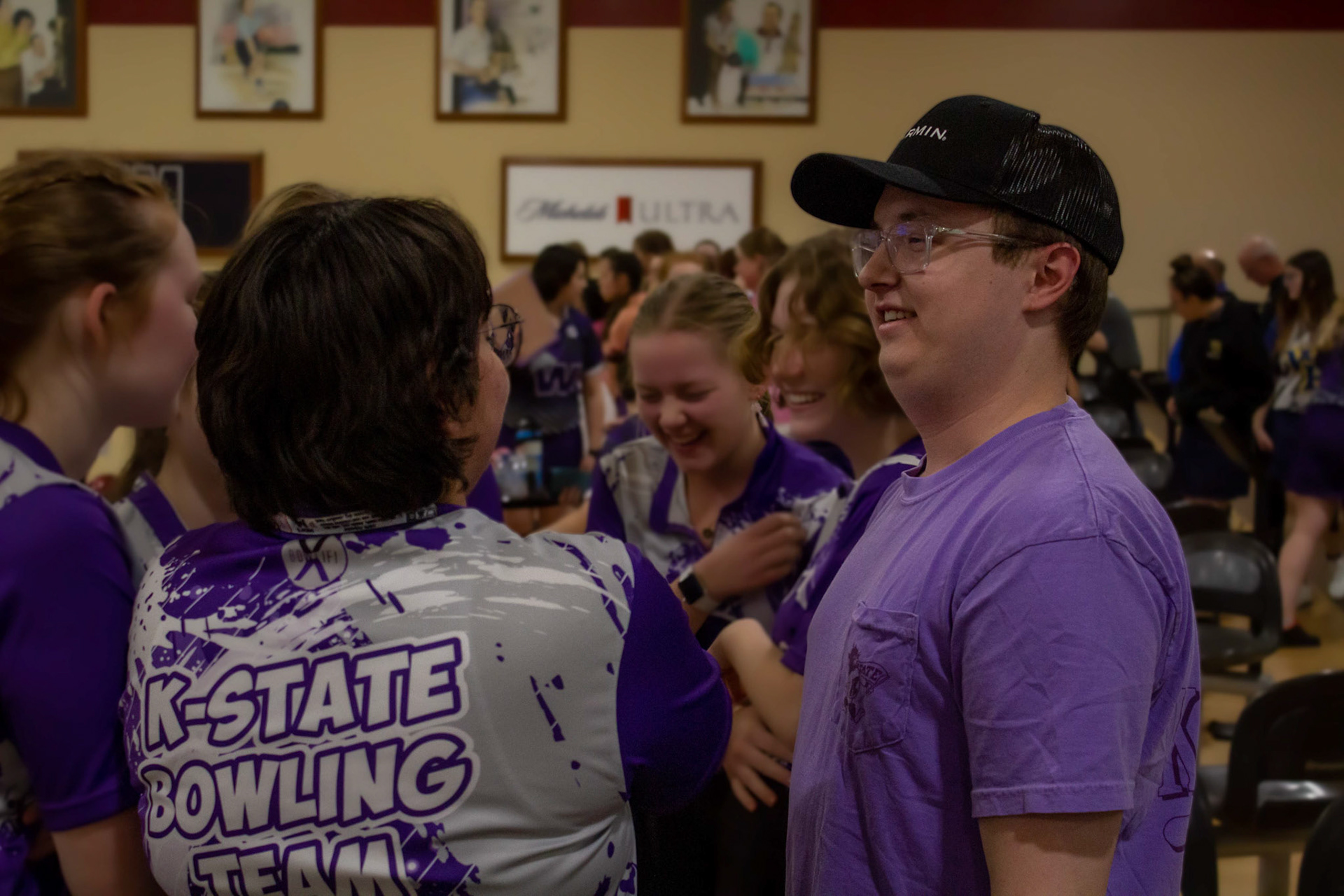 Women's senior team rep Lizzie talks with Cam following his final team breakdown.