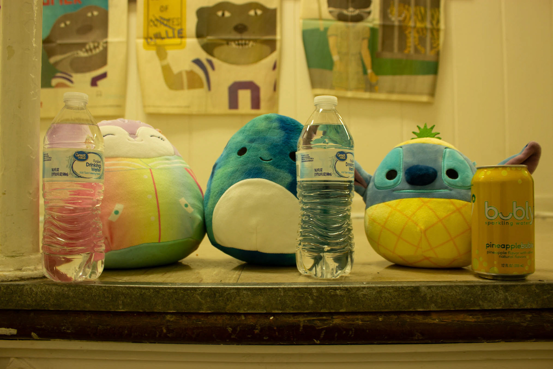Sydnee, Damien and Stitch all grab their favorite drinks. The drinks help visualize each Squishmallow's size, which can be small, medium or large.