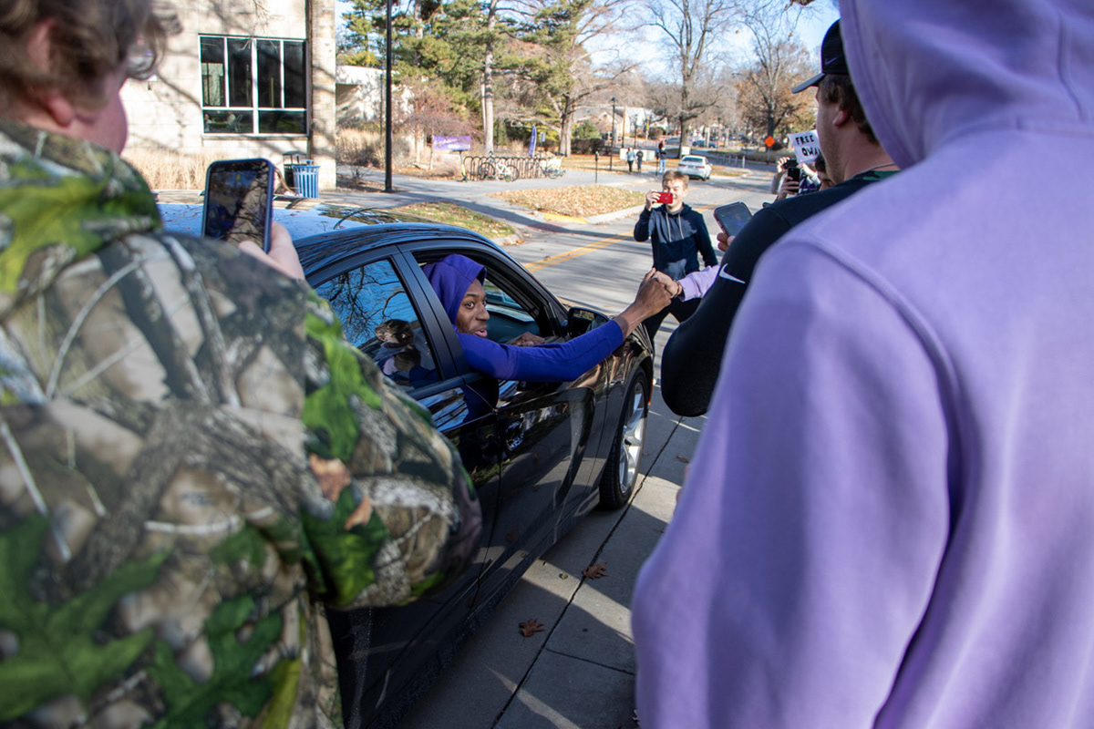 Forward Nae'Qwan Tomlin greets protesters in front of President Richard Linton's residence. The student-led protest on Wednesday was over Tomlin's suspension. (Featured in the Collegian)